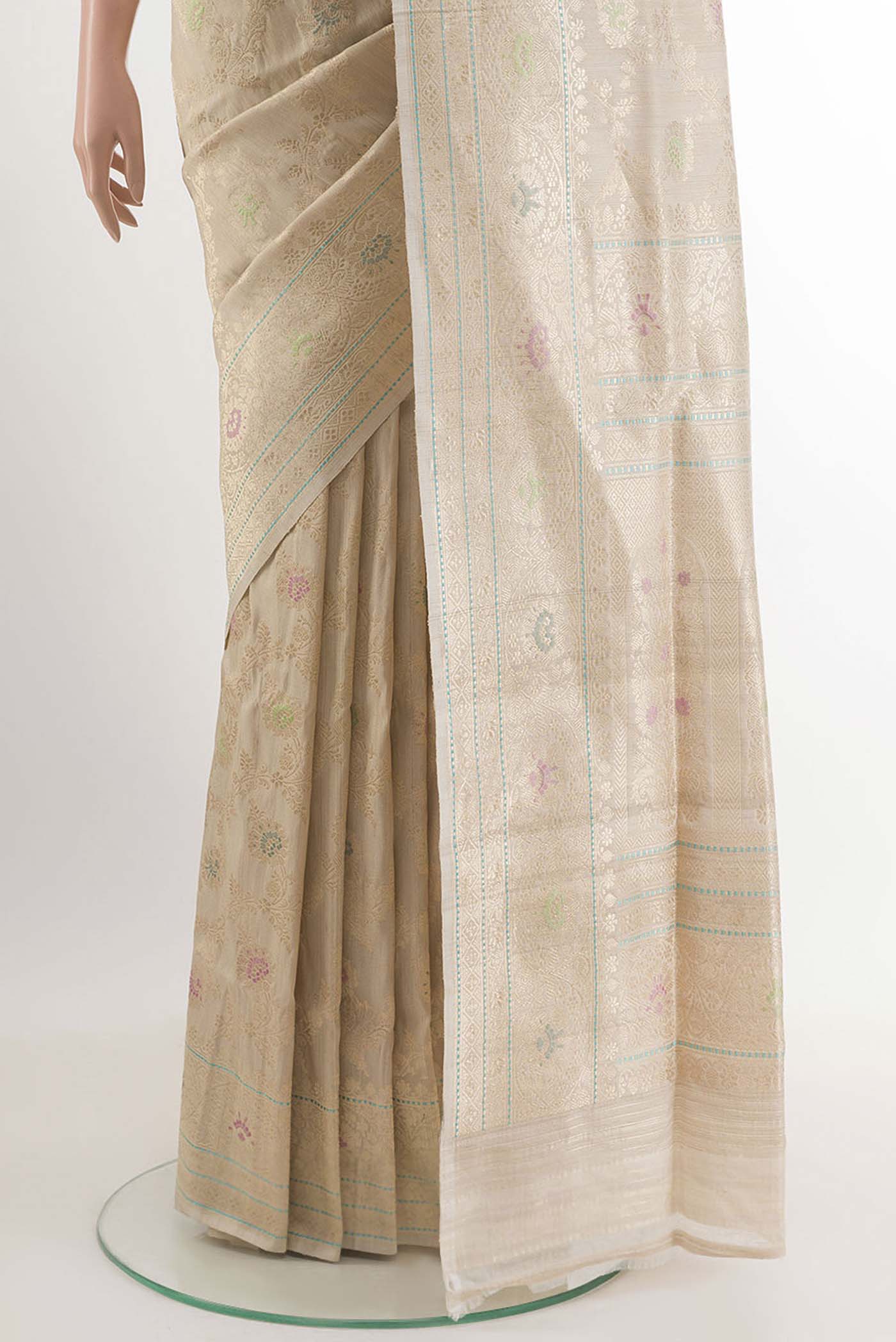 Pleats and pallu of Off White Banarasi Tussar Silk Saree with Zari Butta on the body and Zari Border. 