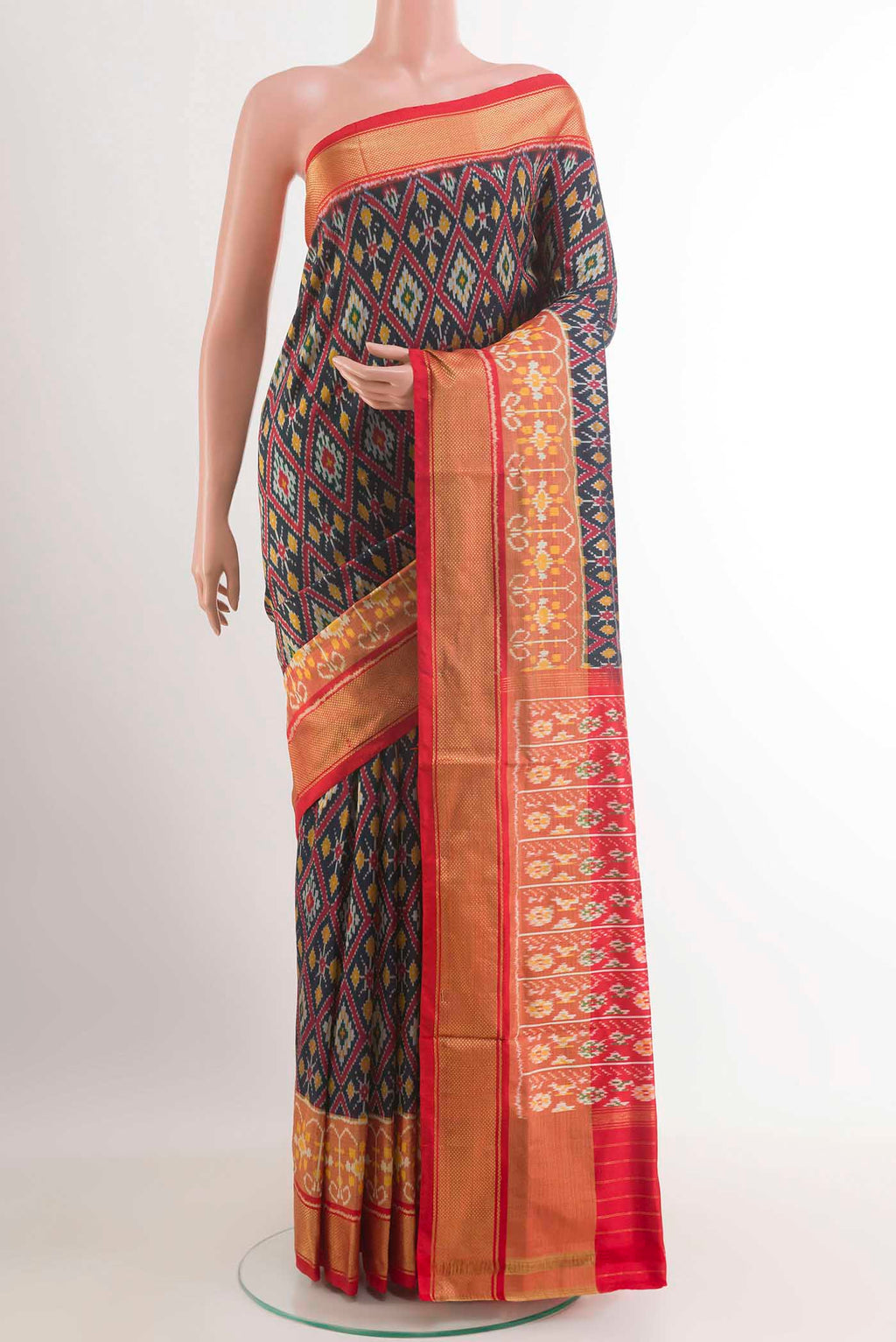 Dark Blue Pochampally Silk Saree with Pure Ikat on the body and Zari Border.  displayed on a mannequin