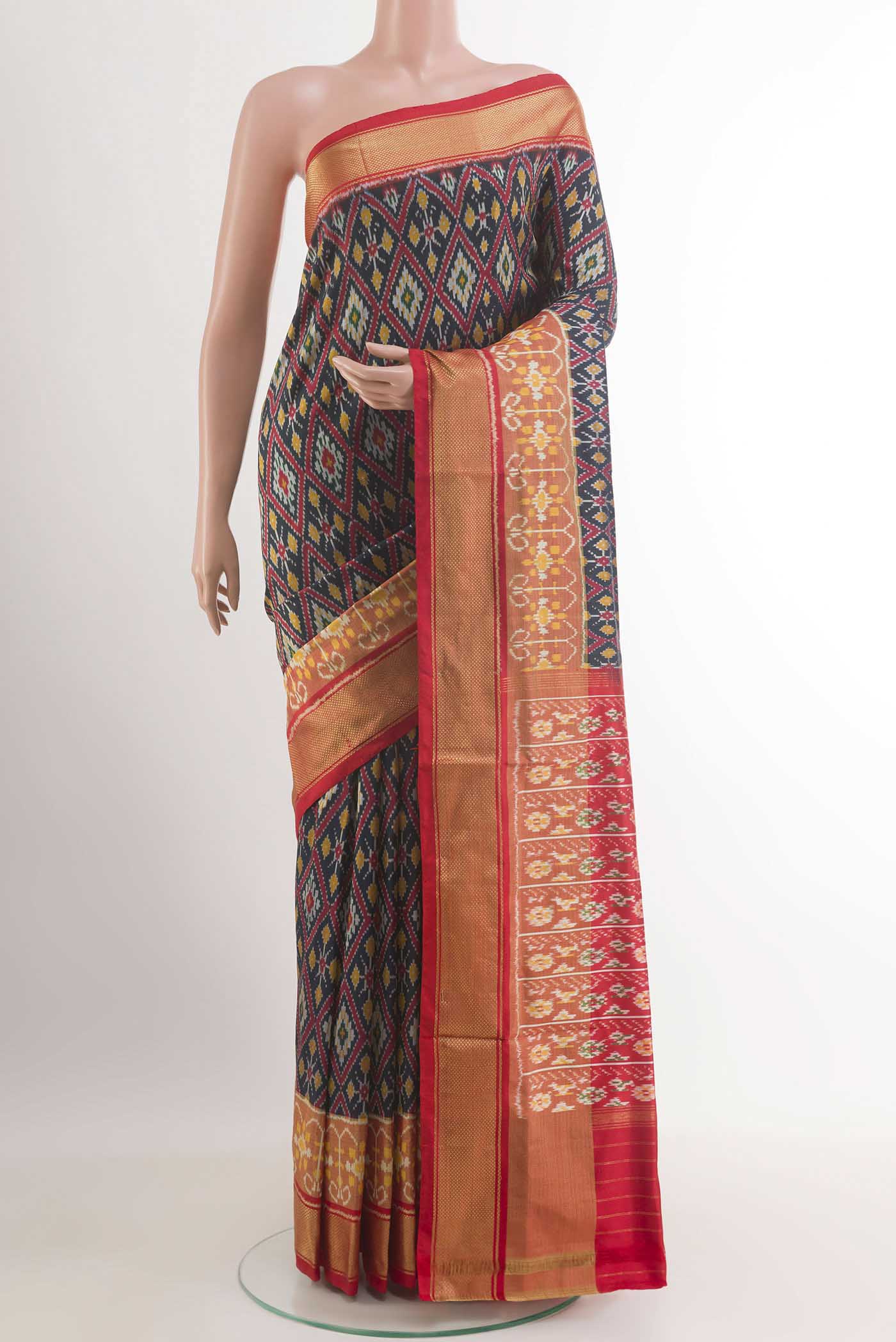 Dark Blue Pochampally Silk Saree with Pure Ikat on the body and Zari Border.  displayed on a mannequin