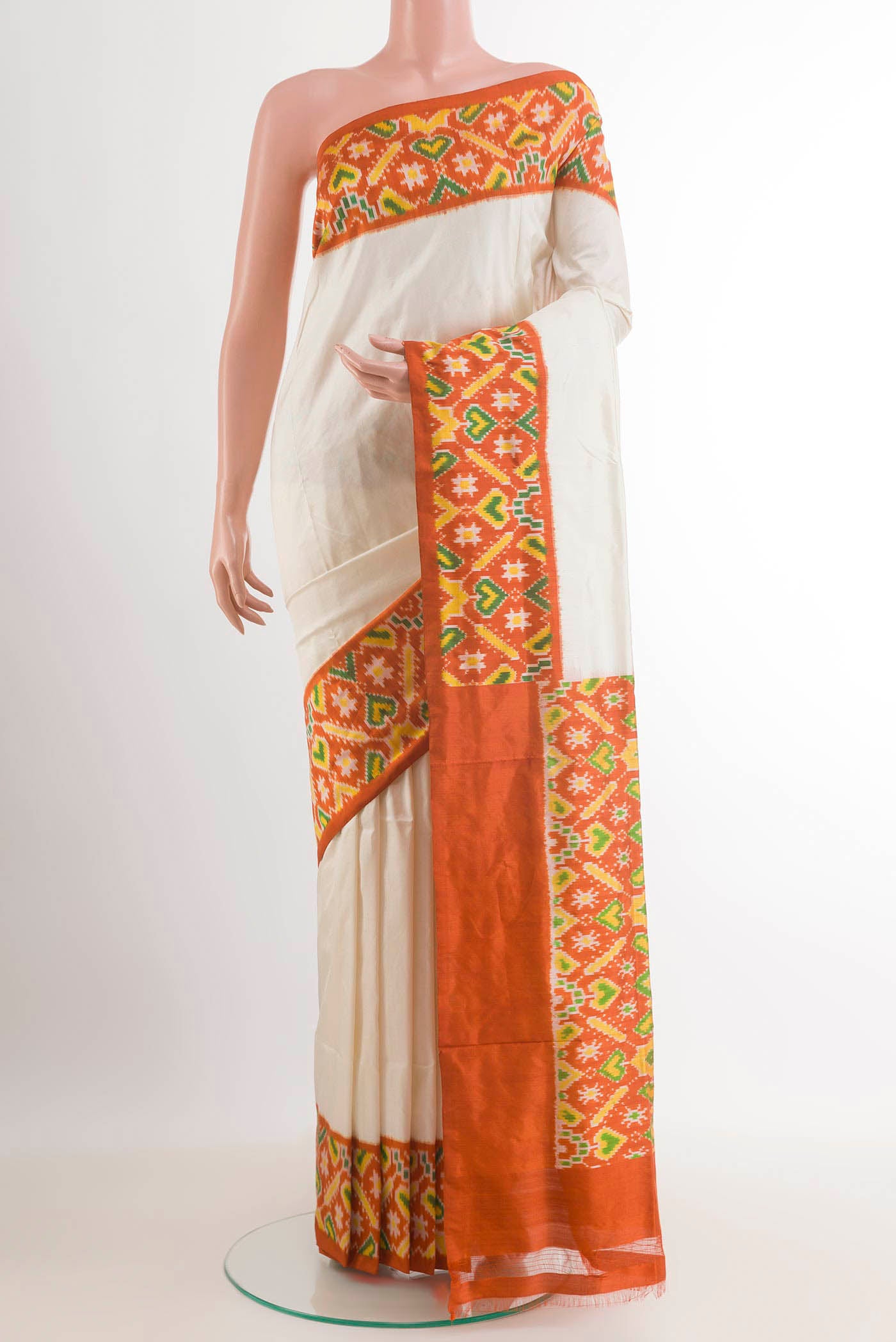 White Pochampally Silk Saree with Plain Body and Ikat Border.  displayed on a mannequin