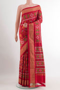 Red Pochampally Silk Saree with Pure Ikat on the body and Zari Border.  displayed on a mannequin