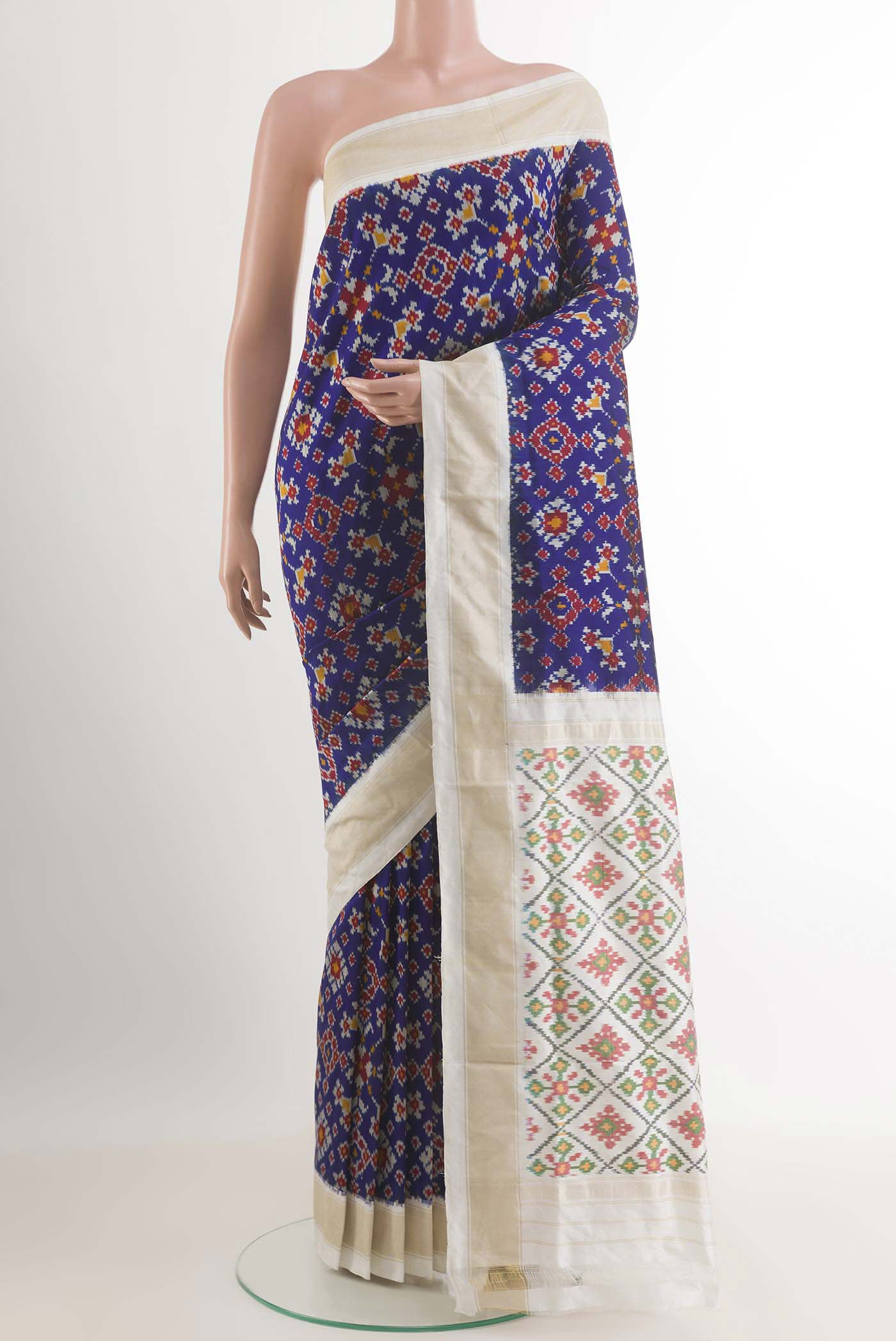 Blue Pochampally Silk Saree with Pure Ikat on the body and Zari Border.  displayed on a mannequin