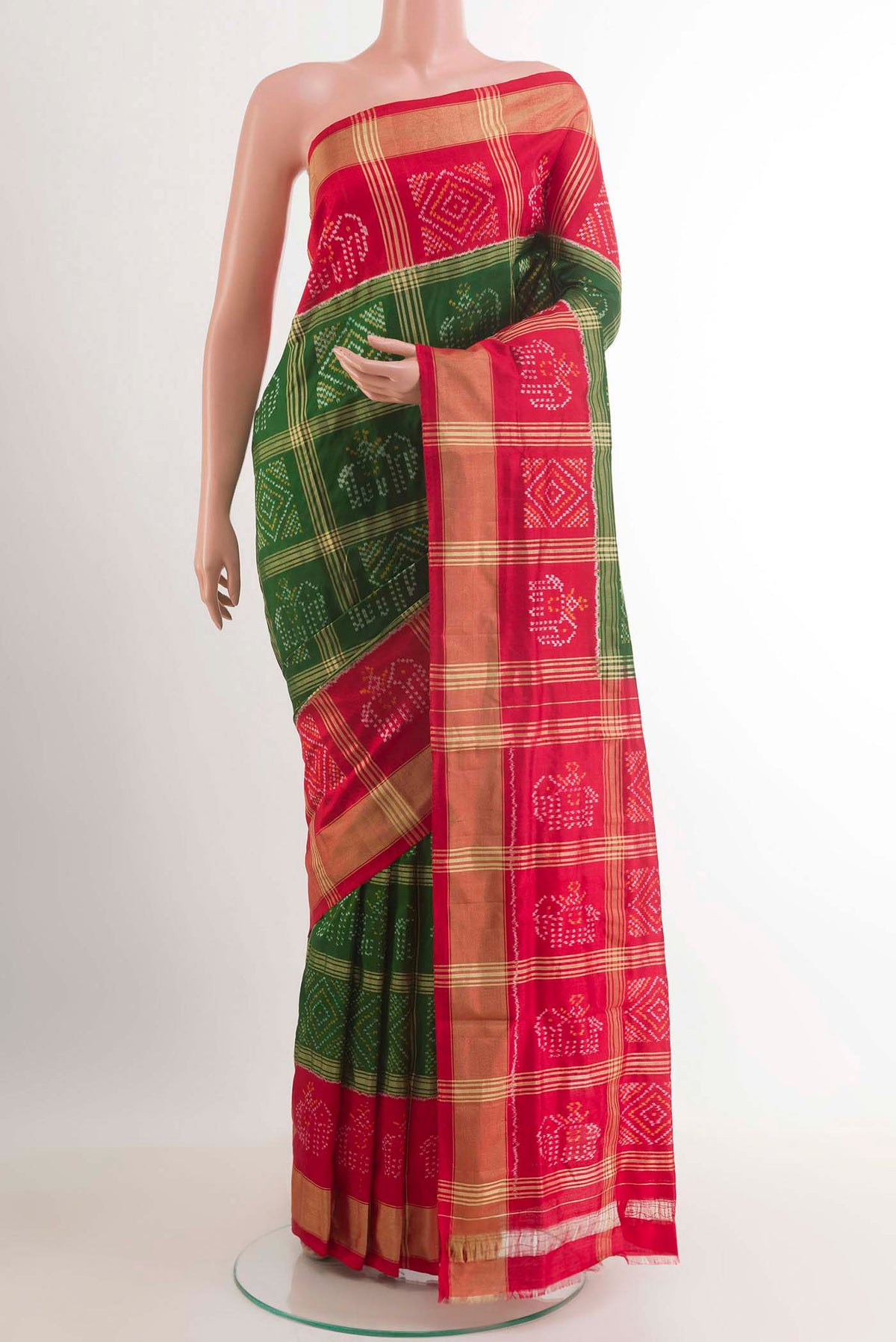 Green Pochampally Silk Saree with Pure Ikat on the body and Zari Border.  displayed on a mannequin