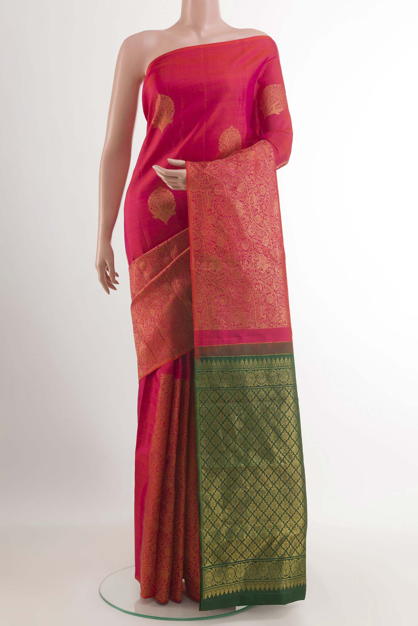 Red Kanjivaram Saree with Zari Butta on the body and Zari Border.  displayed on a mannequin
