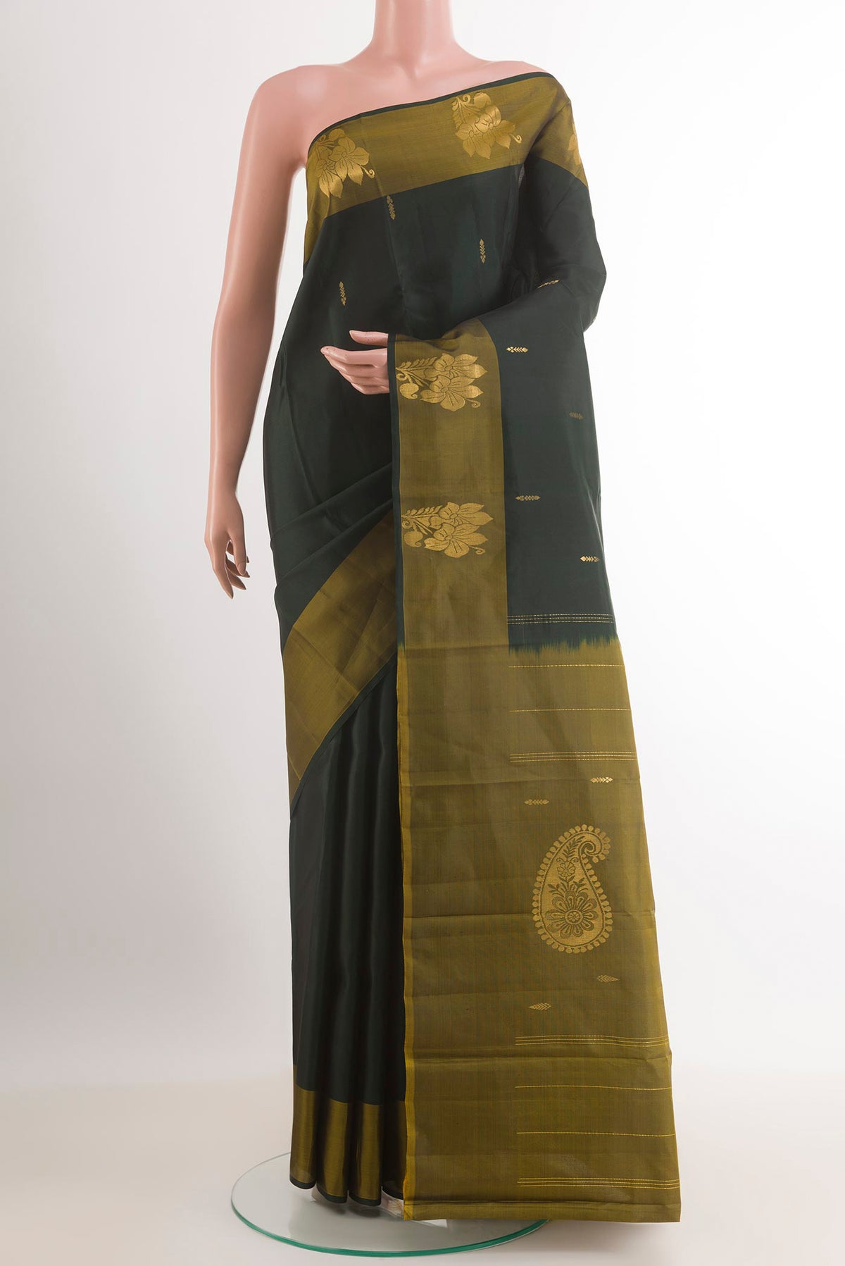 Bottle Green Kanchipuram Silk Saree with Zari Butta on the body and Zari Border.  displayed on a mannequin