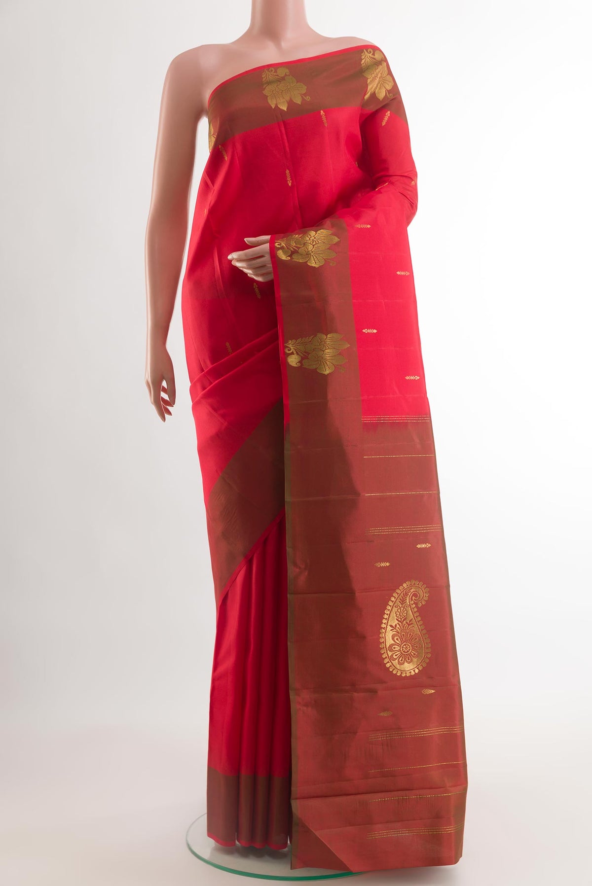 Red Kanchipuram Silk Saree with Zari Butta on the body and Zari Border.  displayed on a mannequin