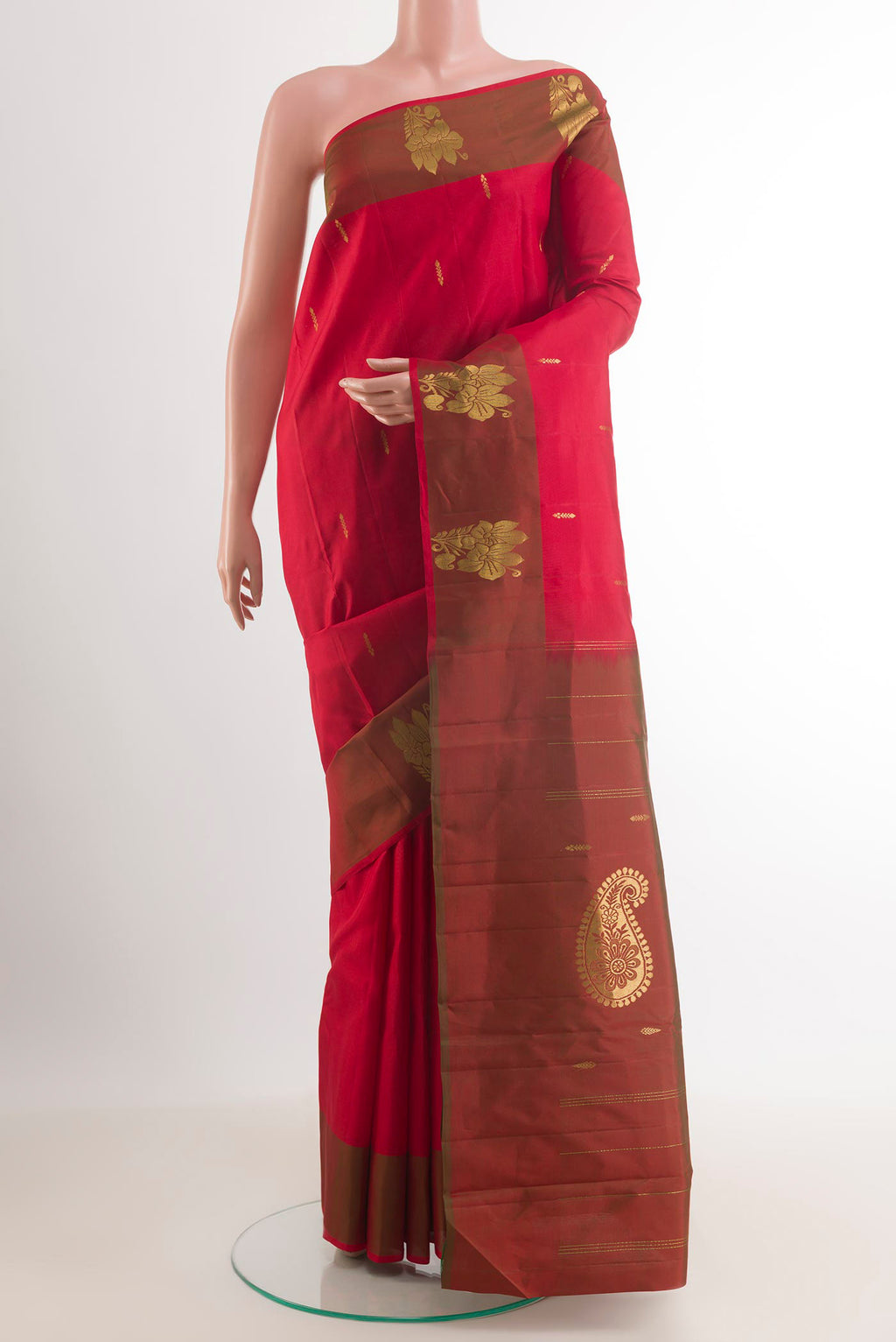 Red Kanchipuram Saree with Zari Butta on the body and Zari Border.  displayed on a mannequin