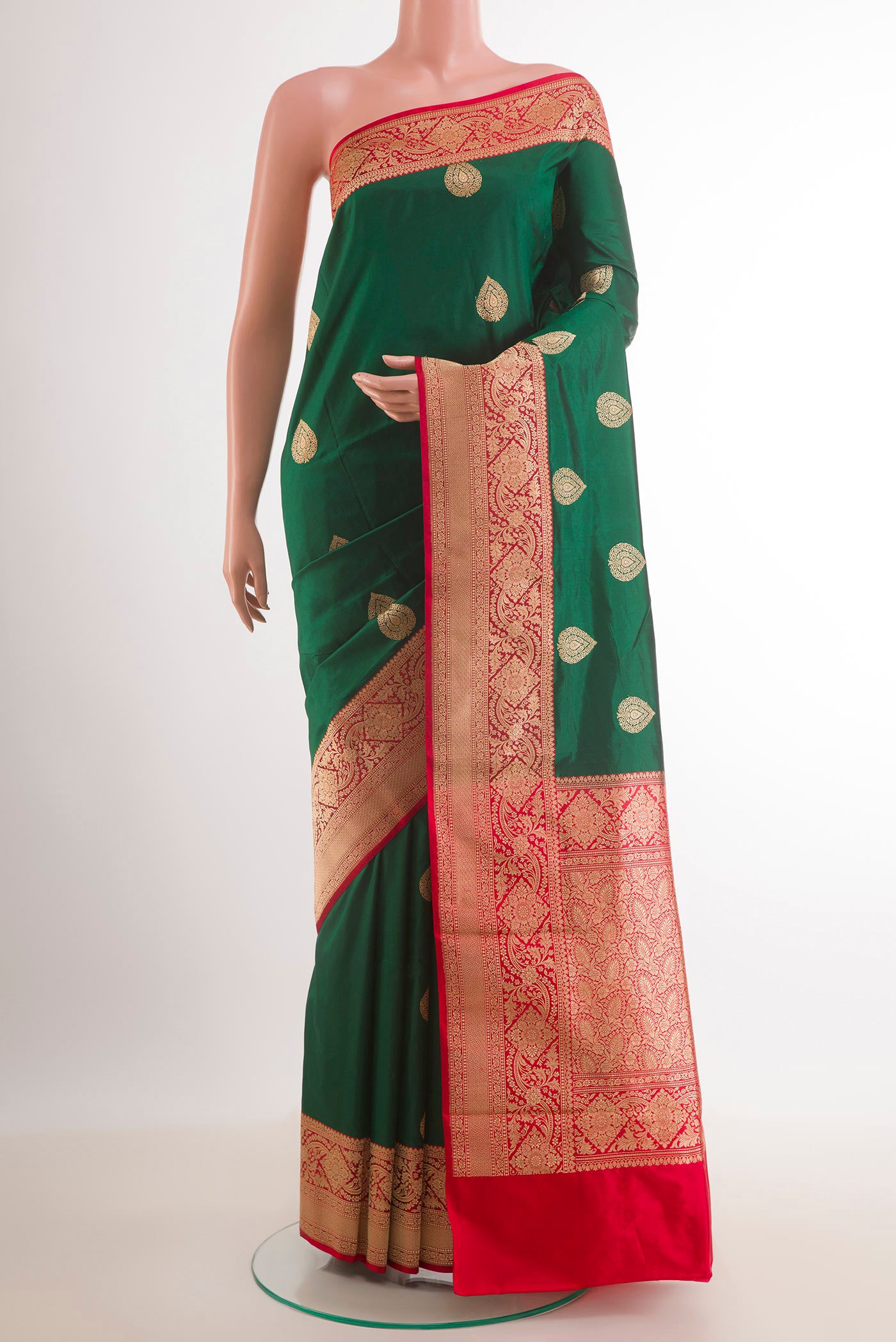 Green Banarasi Katan Silk Saree with Zari Butta on the body and Zari Border.  displayed on a mannequin