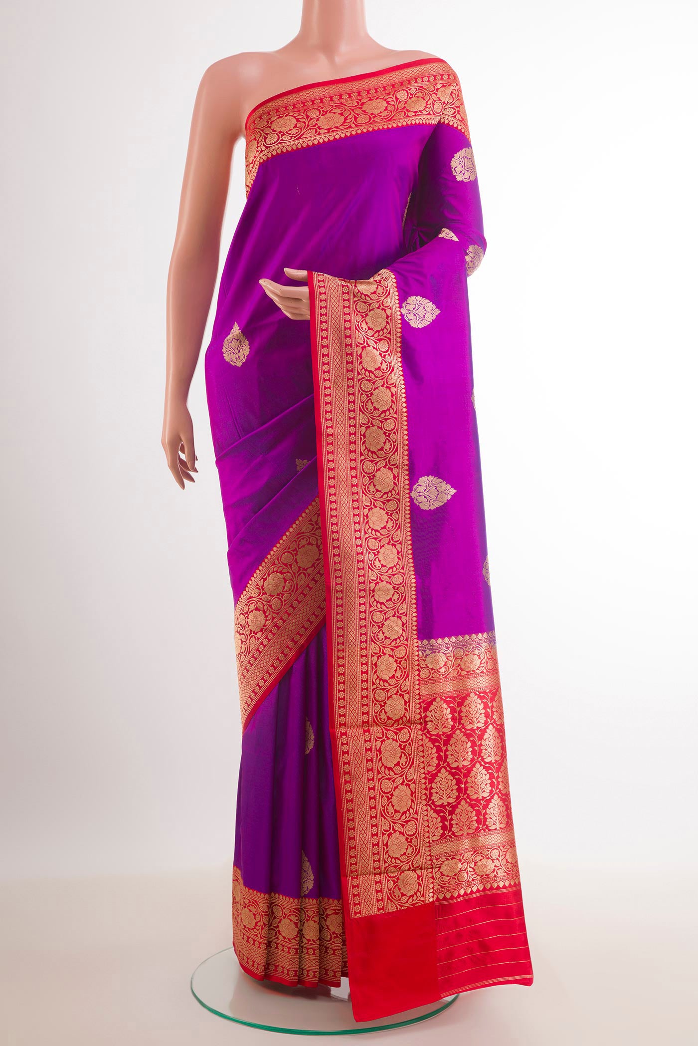 Purple Banarasi Katan Silk Saree with Zari Butta on the body and Zari Border.  displayed on a mannequin
