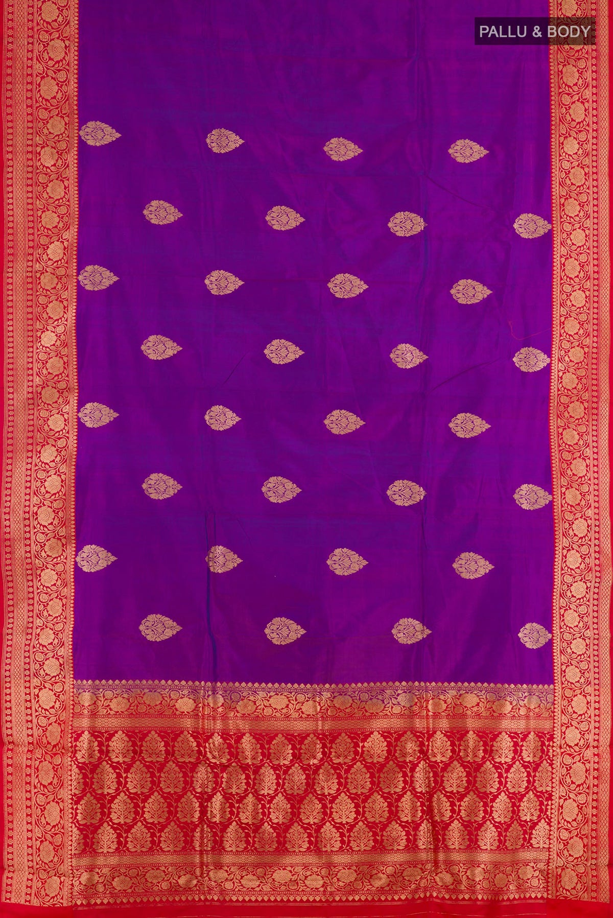 Flat view of Purple Banarasi Katan Silk Saree with Zari Butta on the body and Zari Border. 