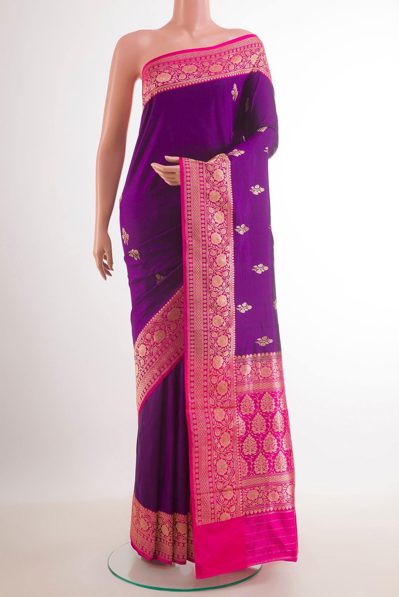 Purple Banarasi Katan Silk Saree with Zari Butta on the body and Zari Border.  displayed on a mannequin