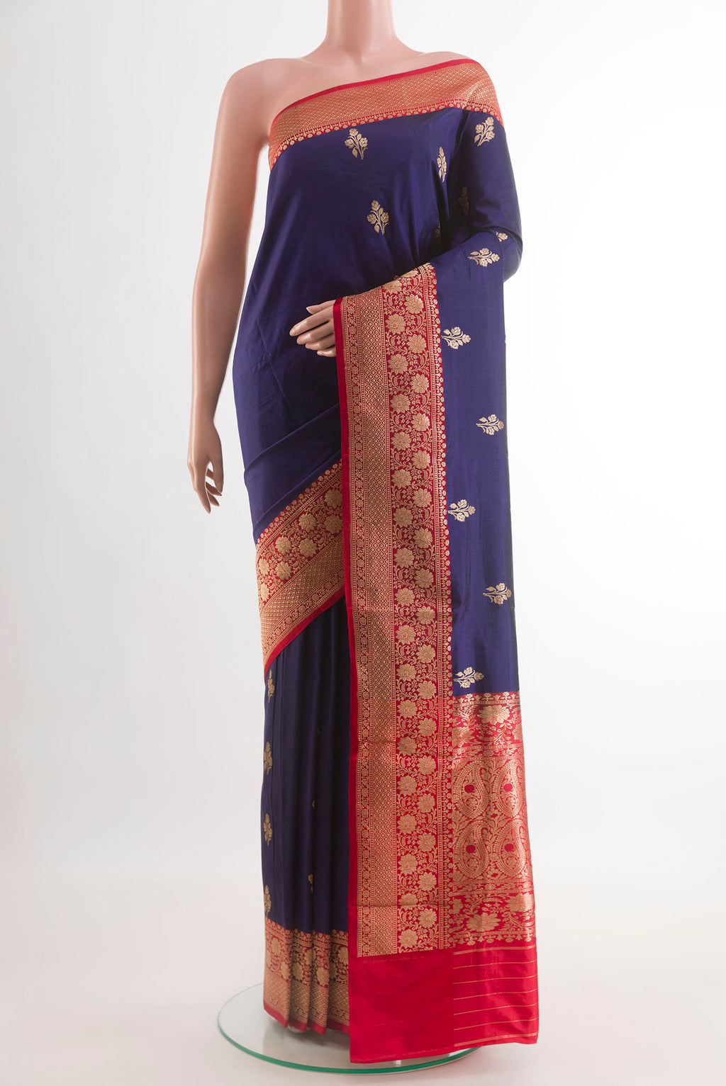 Navy Blue Banarasi Katan Silk Saree with Zari Butta on the body and Zari Border.  displayed on a mannequin