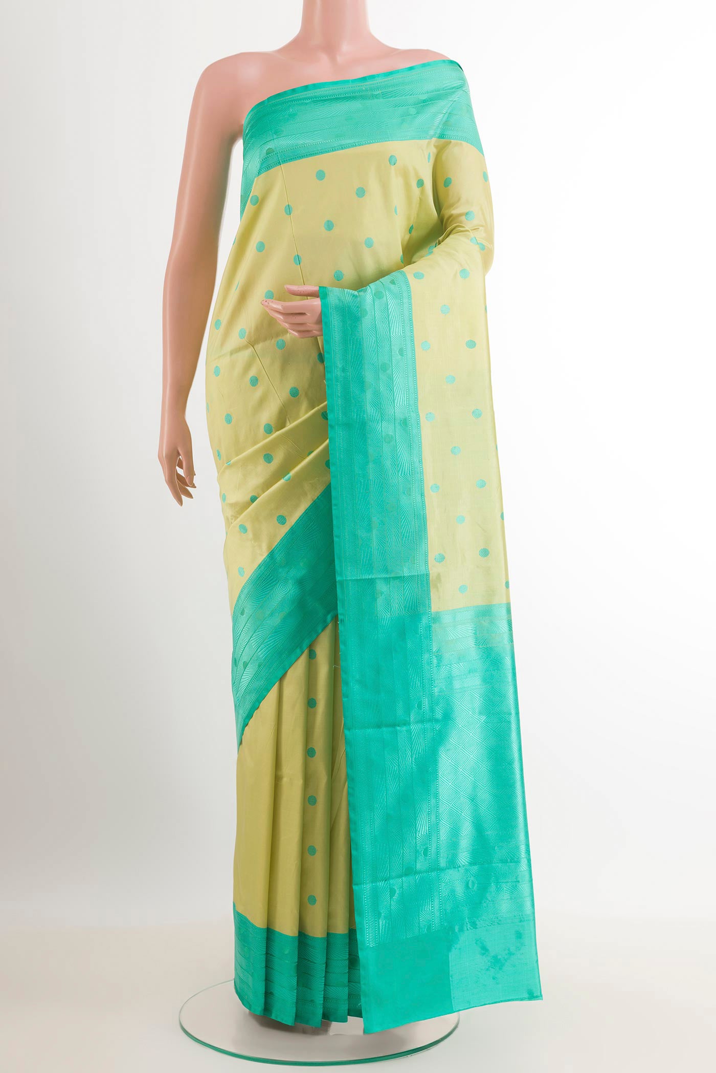 Lemon Yellow Soft Silk Saree with Thread Butta on the body and Embroidery Border.  displayed on a mannequin