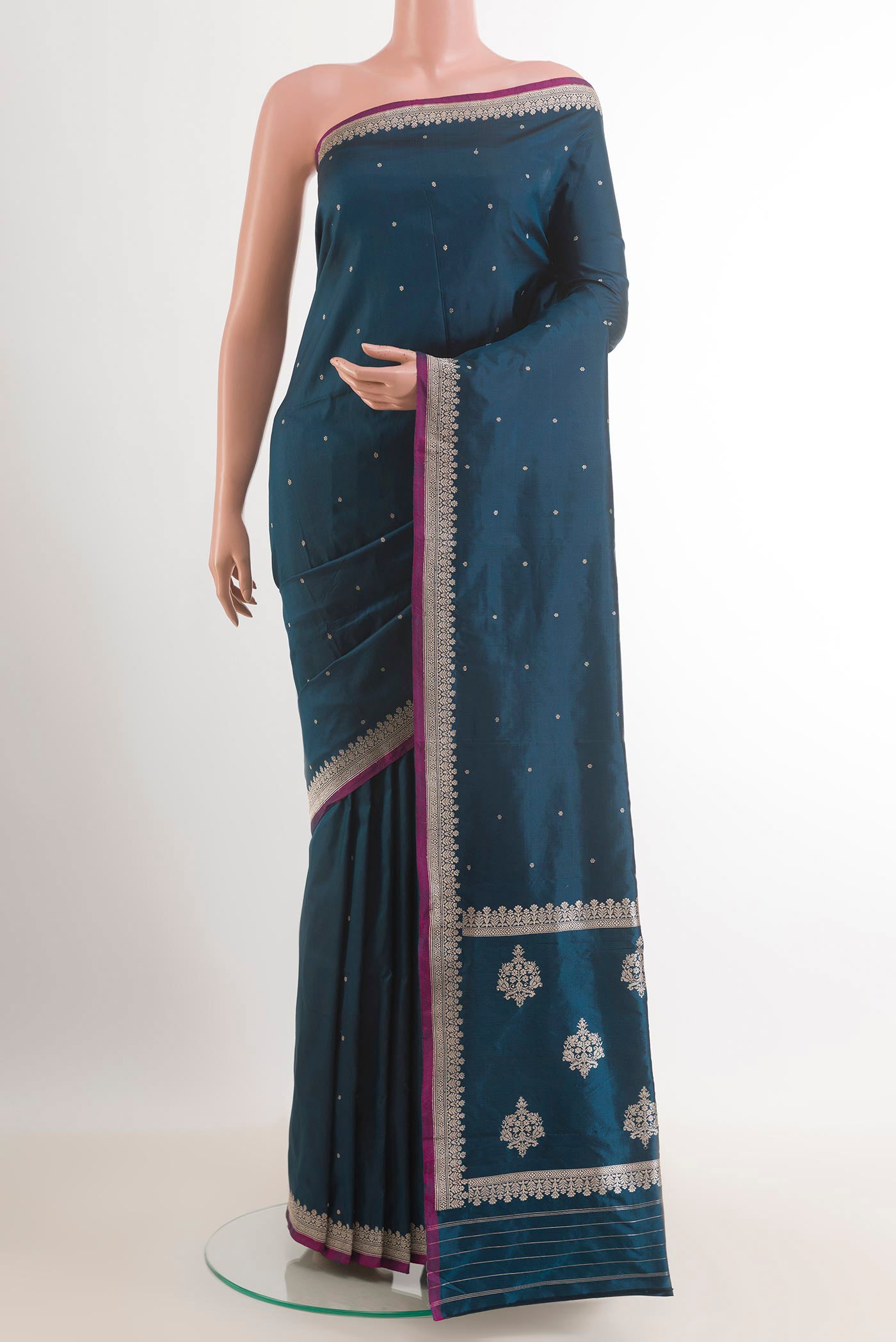 Royal Blue Banarasi Katan Silk Saree with Plain Body and Zari Border.  displayed on a mannequin