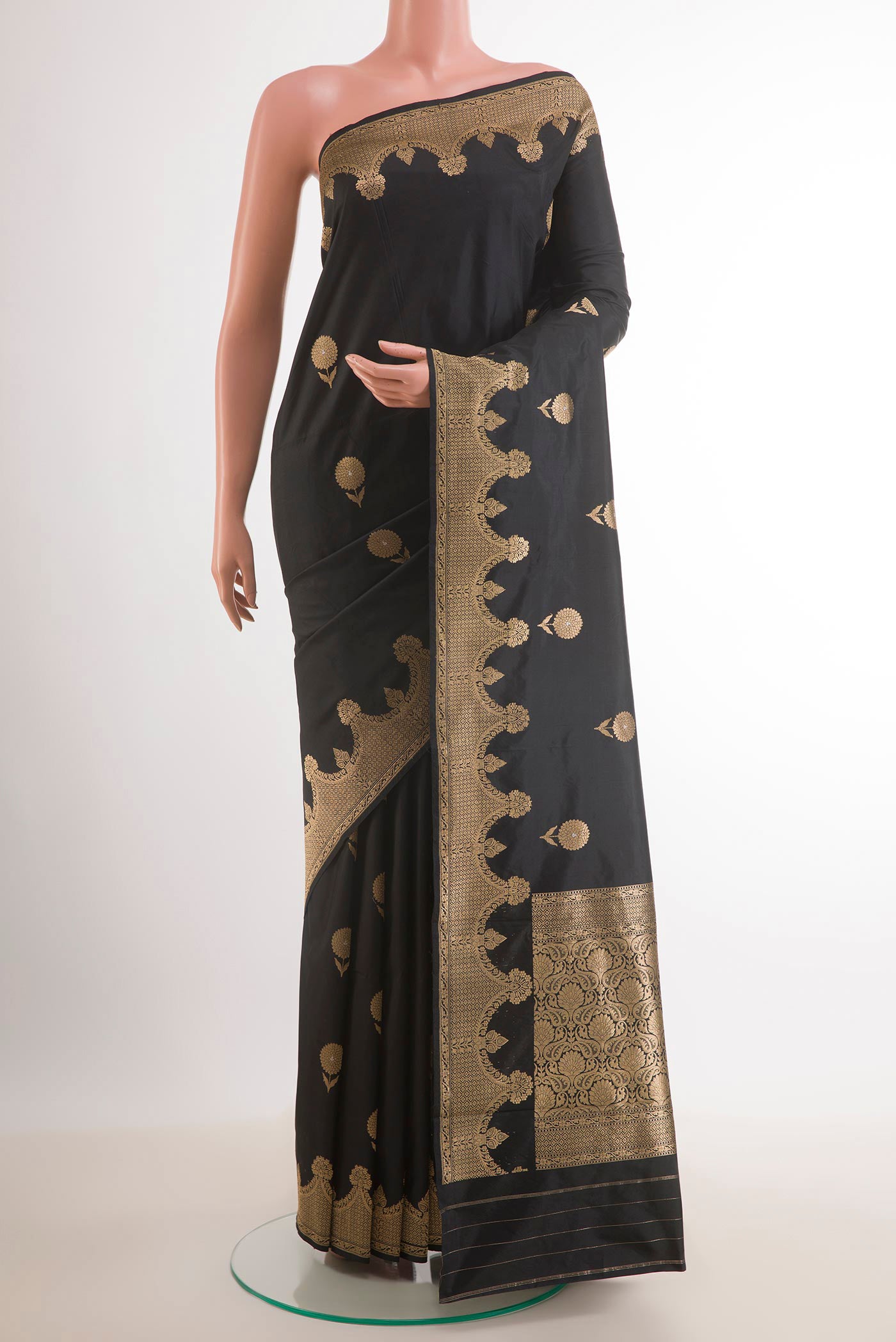Black Banarasi Katan Silk Saree with Zari Butta on the body and Zari Border.  displayed on a mannequin