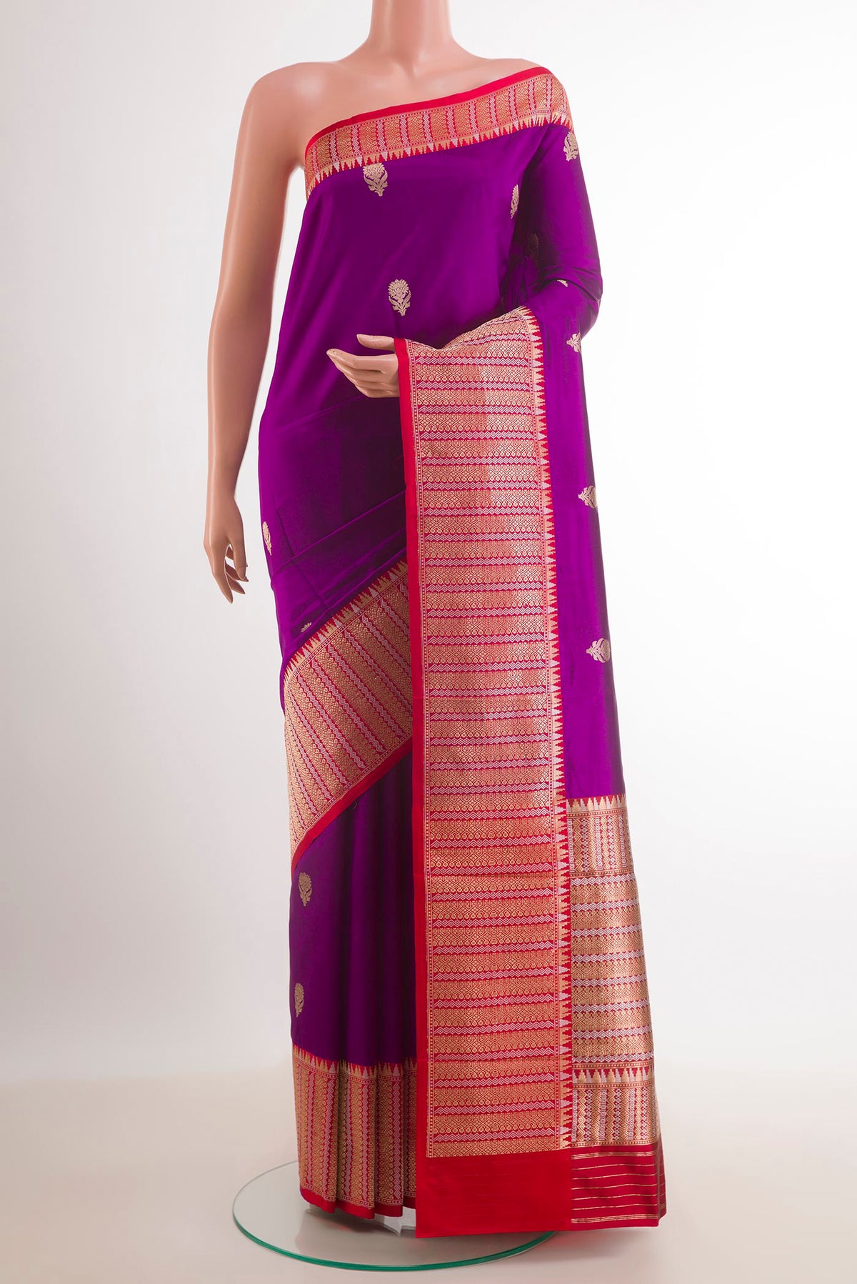 Purple Banarasi Katan Silk Saree with Zari Butta on the body and Zari Border.  displayed on a mannequin
