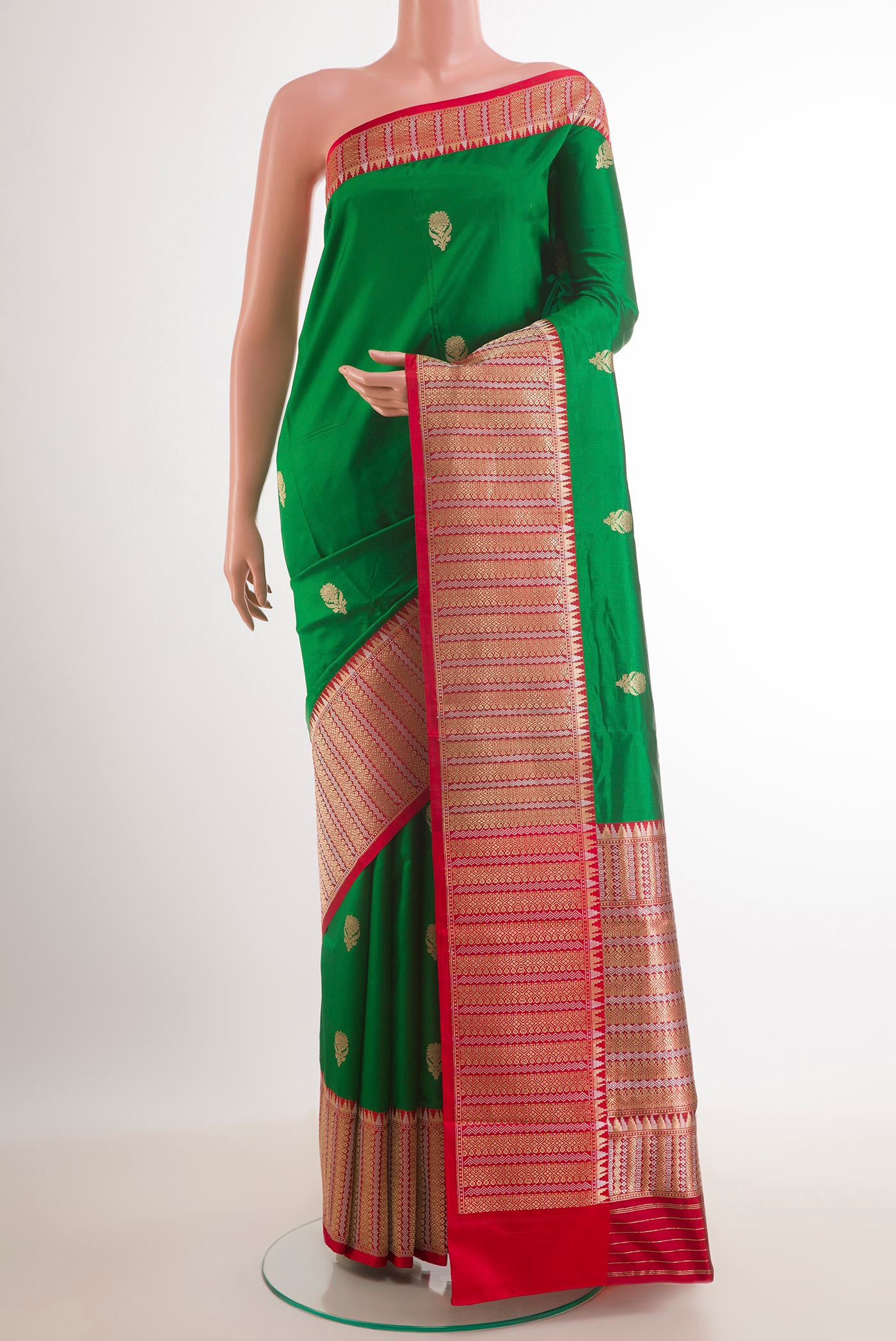 Green Banarasi Katan Silk Saree with Zari Butta on the body and Zari Border.  displayed on a mannequin
