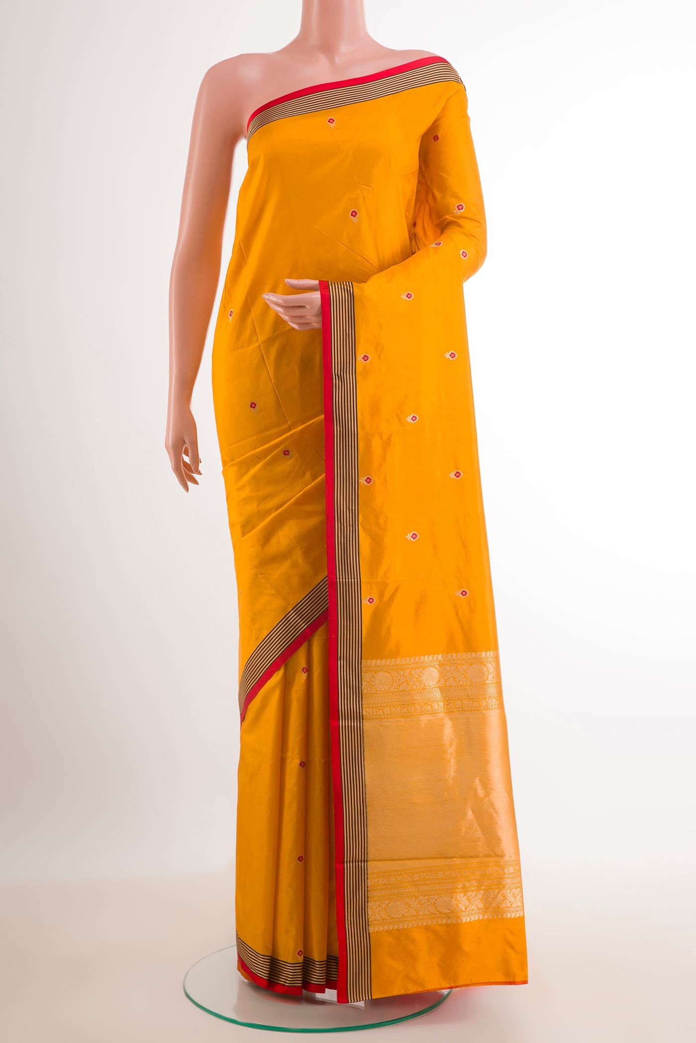 Yellow Banarasi Katan Silk Saree with Zari Butta on the body and Zari Border.  displayed on a mannequin