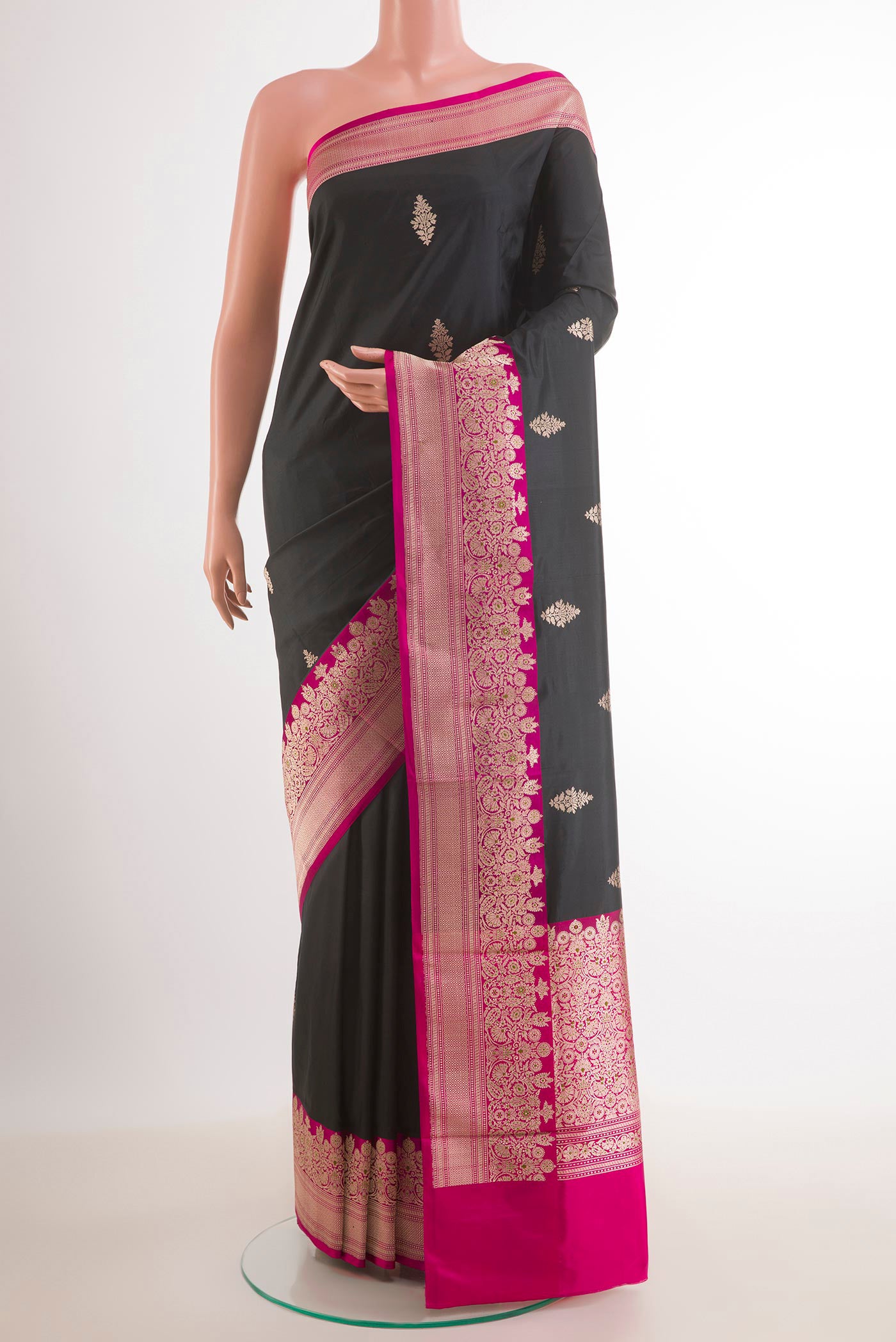 Black Banarasi Katan Silk Saree with Zari Butta on the body and Zari Border.  displayed on a mannequin