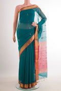 Blue Blended Kora Cotton Saree with Zari Butta on the body and Zari Border.  displayed on a mannequin