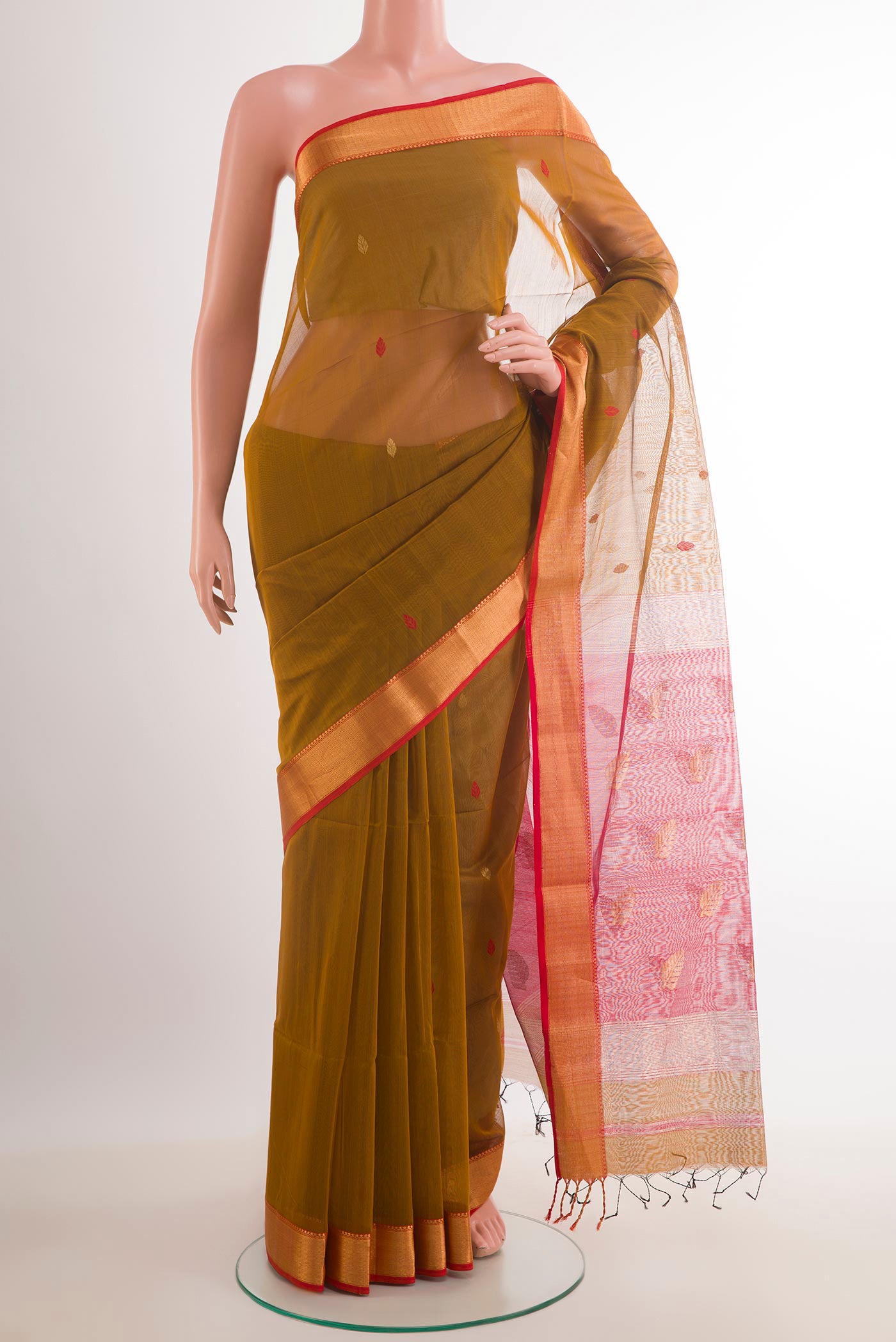 Mustard Blended Kora Cotton Saree with Zari And Thread Butta on the body and Zari Border.  displayed on a mannequin