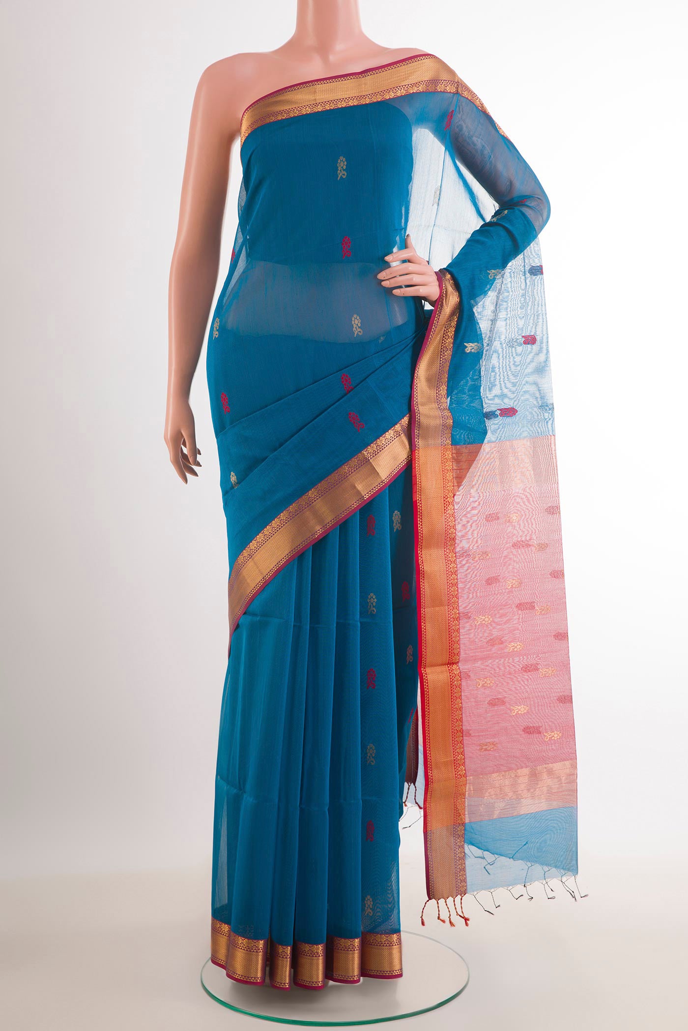 Blue Blended Kora Cotton Saree with Zari Butta on the body and Zari Border.  displayed on a mannequin