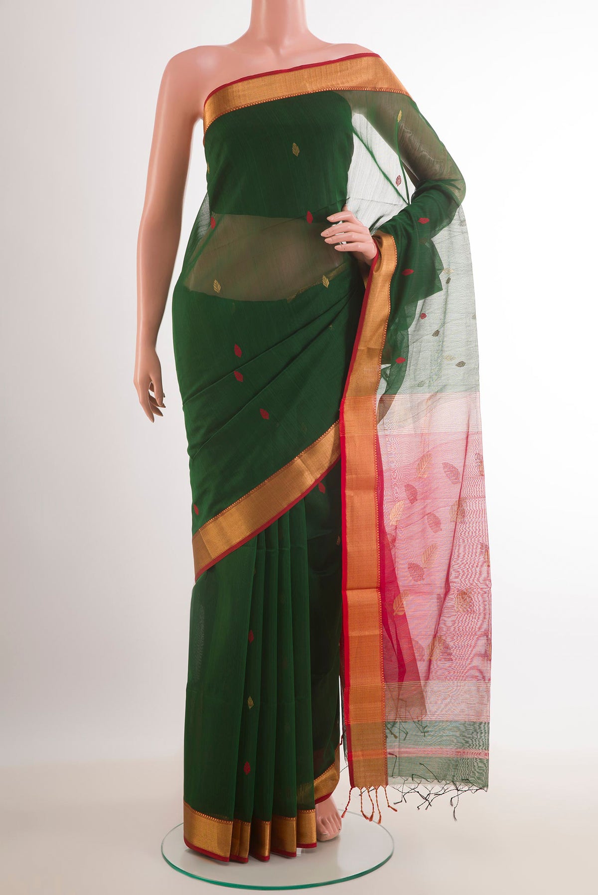 Green Blended Kora Cotton Saree with Zari And Thread Butta on the body and Zari Border.  displayed on a mannequin