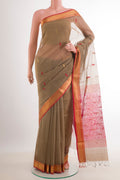 Beige Blended Kora Cotton Saree with Zari And Thread Butta on the body and Zari Border.  displayed on a mannequin
