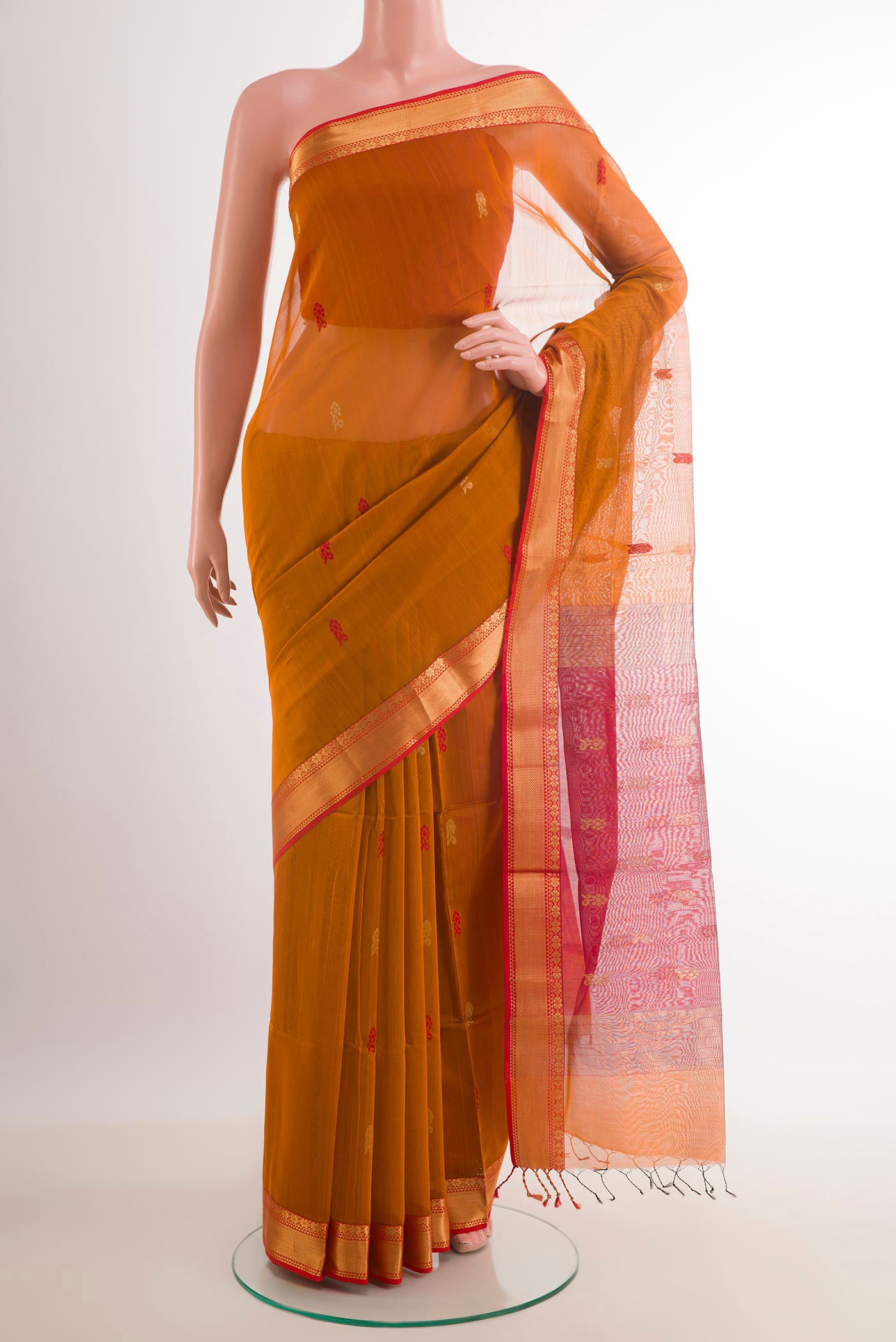 Mustard Blended Kora Cotton Saree with Zari Butta on the body and Zari Border.  displayed on a mannequin