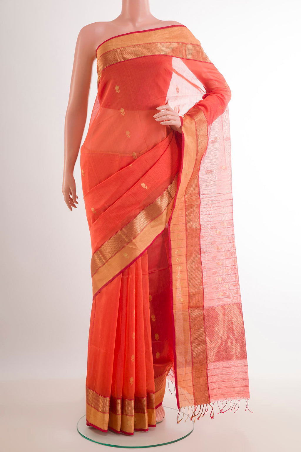 Peach Blended Kora Cotton Saree with Zari Butta on the body and Zari Border.  displayed on a mannequin