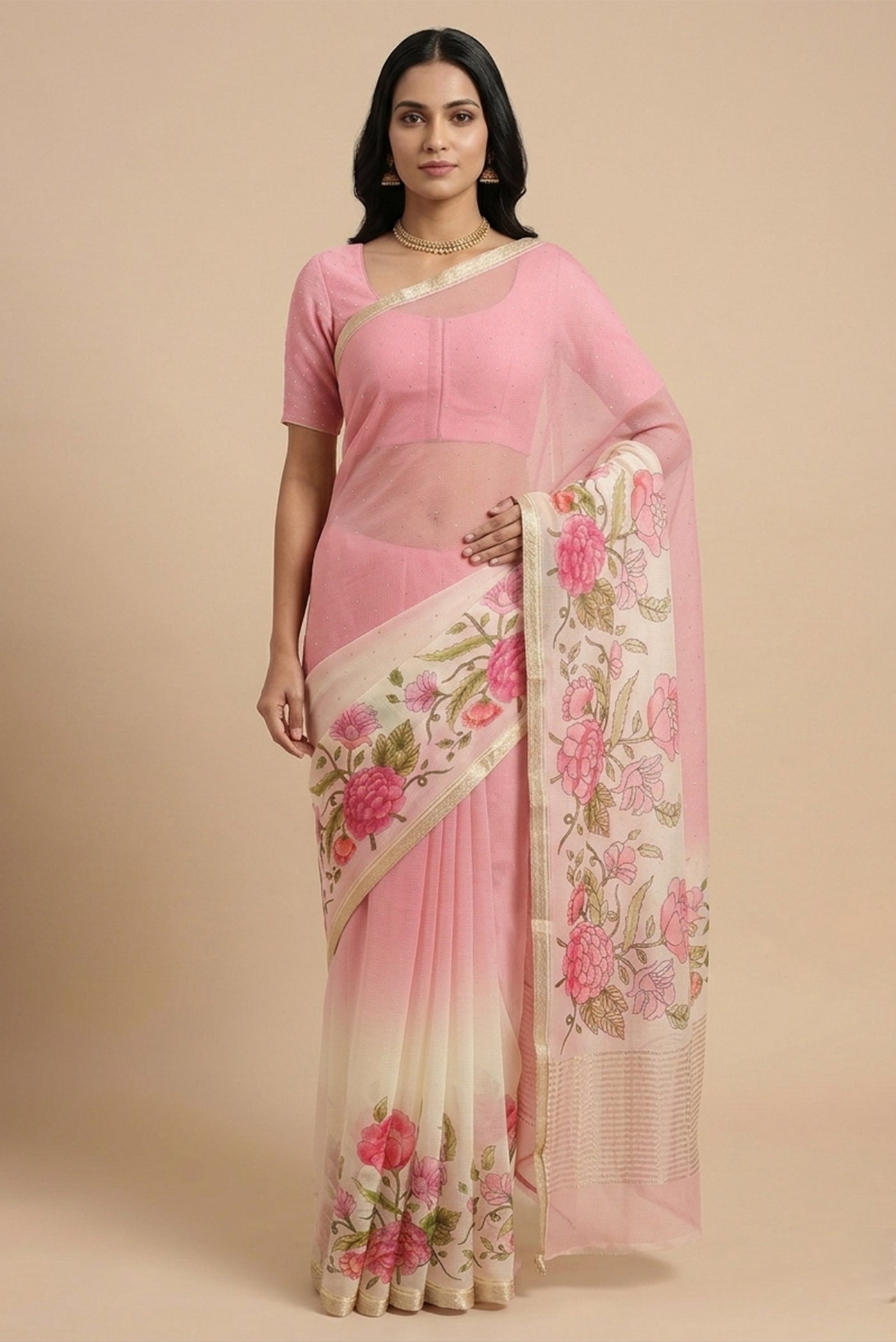 Model wearing a Rose pink Mysore Chiffon Saree with Embroidery on the body and Zari Border.