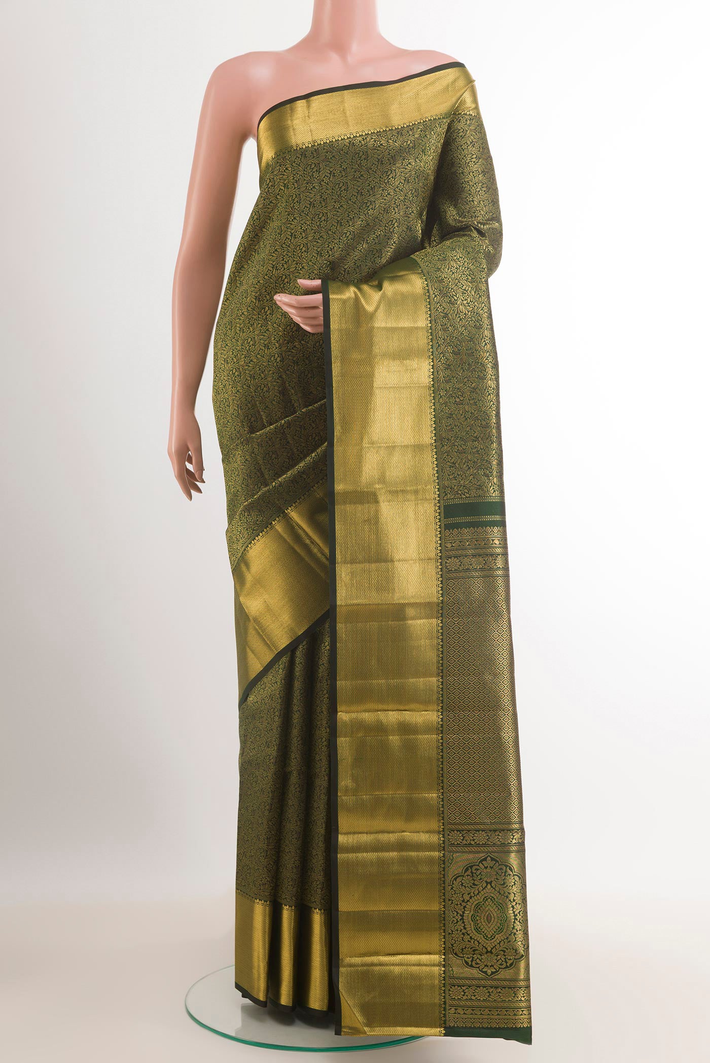 Bottle Green Kanjivaram Silk Saree with Zari Brocade on the body and Zari Border.  displayed on a mannequin