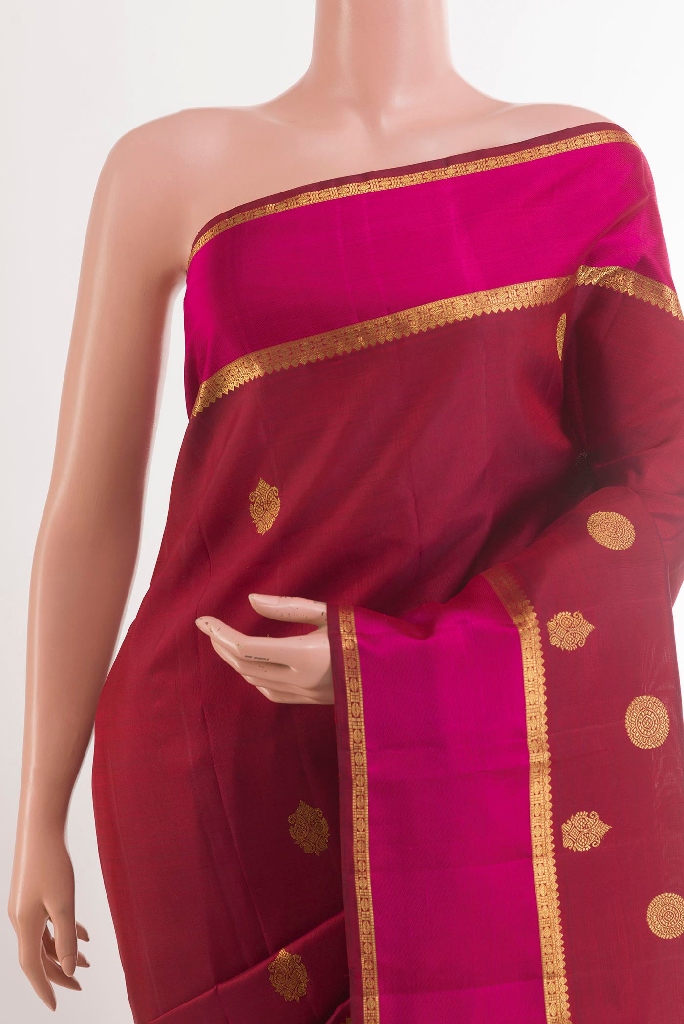 Border image of Maroon Kanjivaram Silk Saree with Zari Butta on the body and Zari Border. 