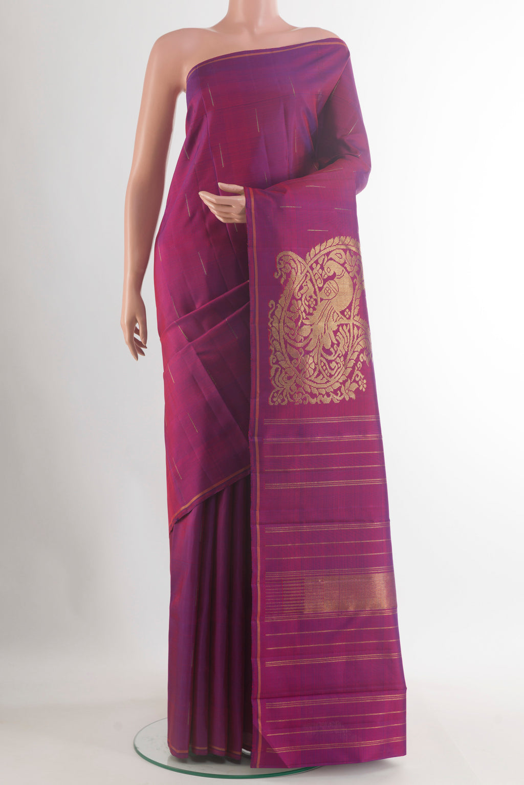 Pure Silk Pure Zari Purple Kanjivaram Saree with Zari Butta on the body and Thin Zari Line.  displayed on a mannequin