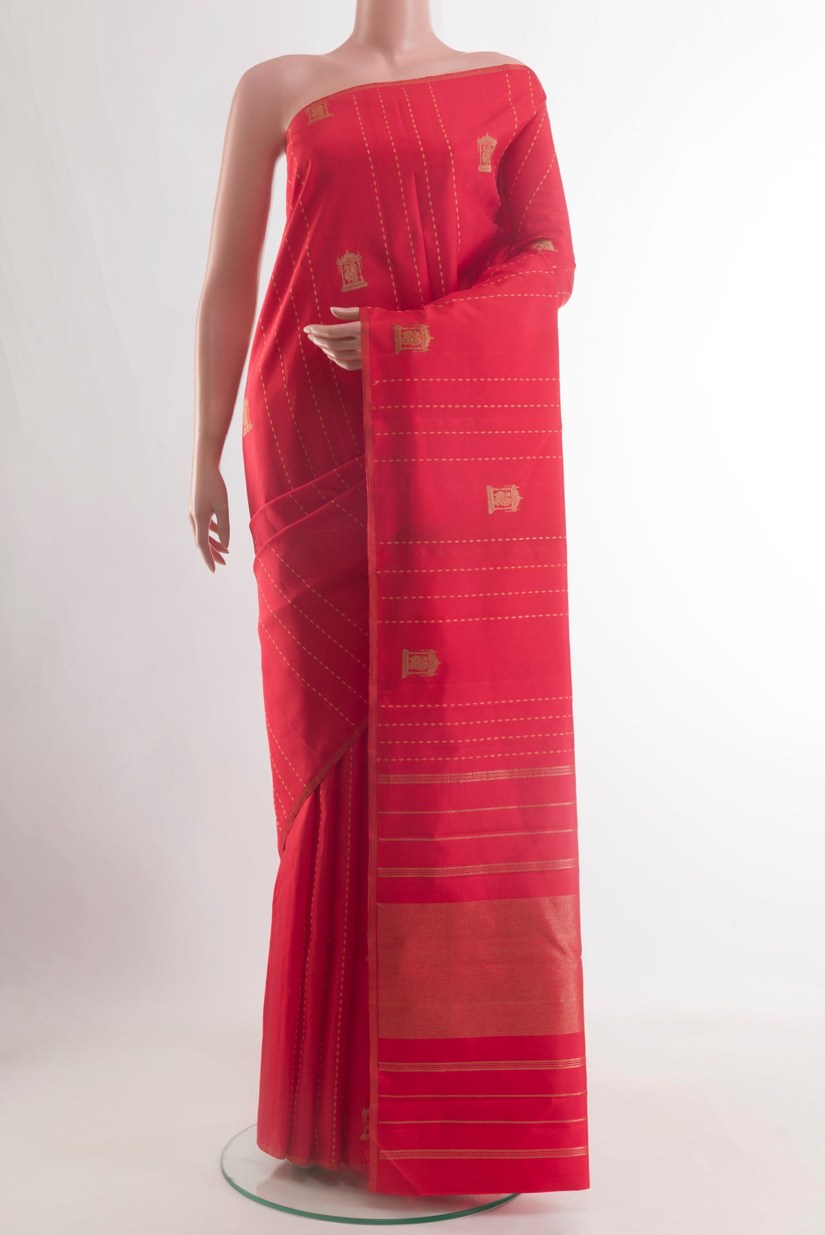 Red Kanjivaram Silk Saree with Stripes on the body and Without Border.  displayed on a mannequin