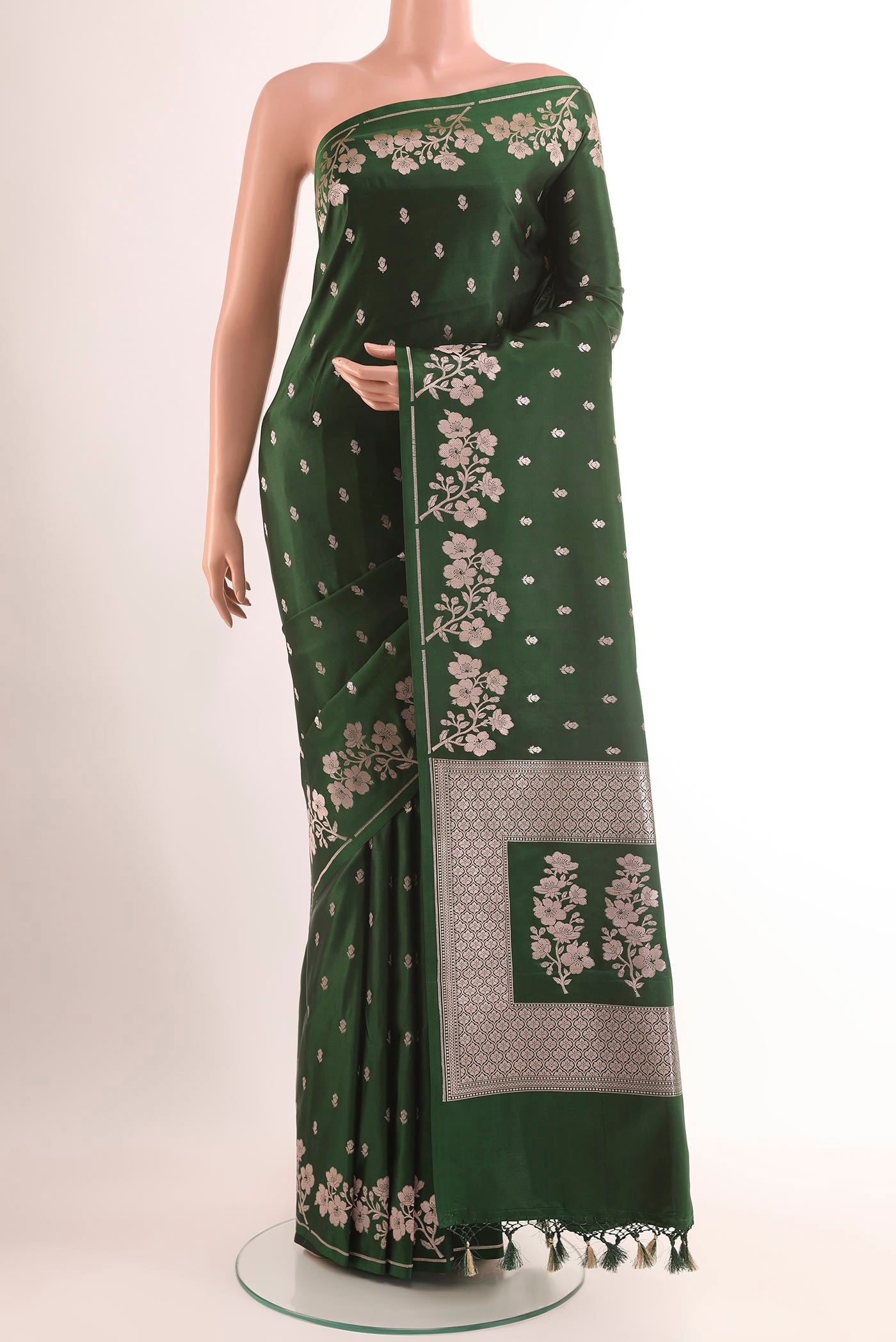 Green Blended Art Silk Saree with Zari Butta on the body and Zari Border.  displayed on a mannequin