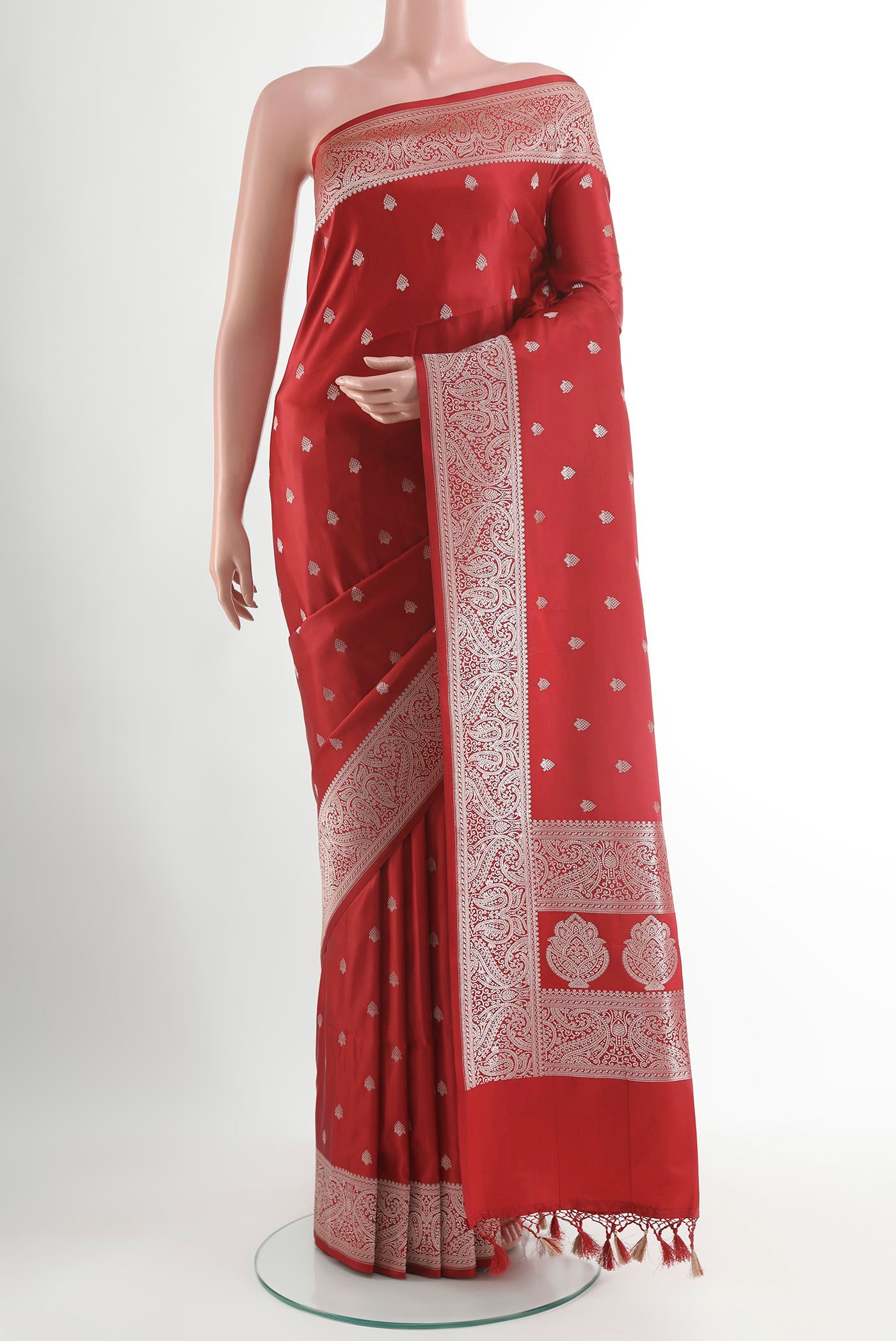 Red Blended Art Silk Saree with Zari Butta on the body and Zari Border.  displayed on a mannequin