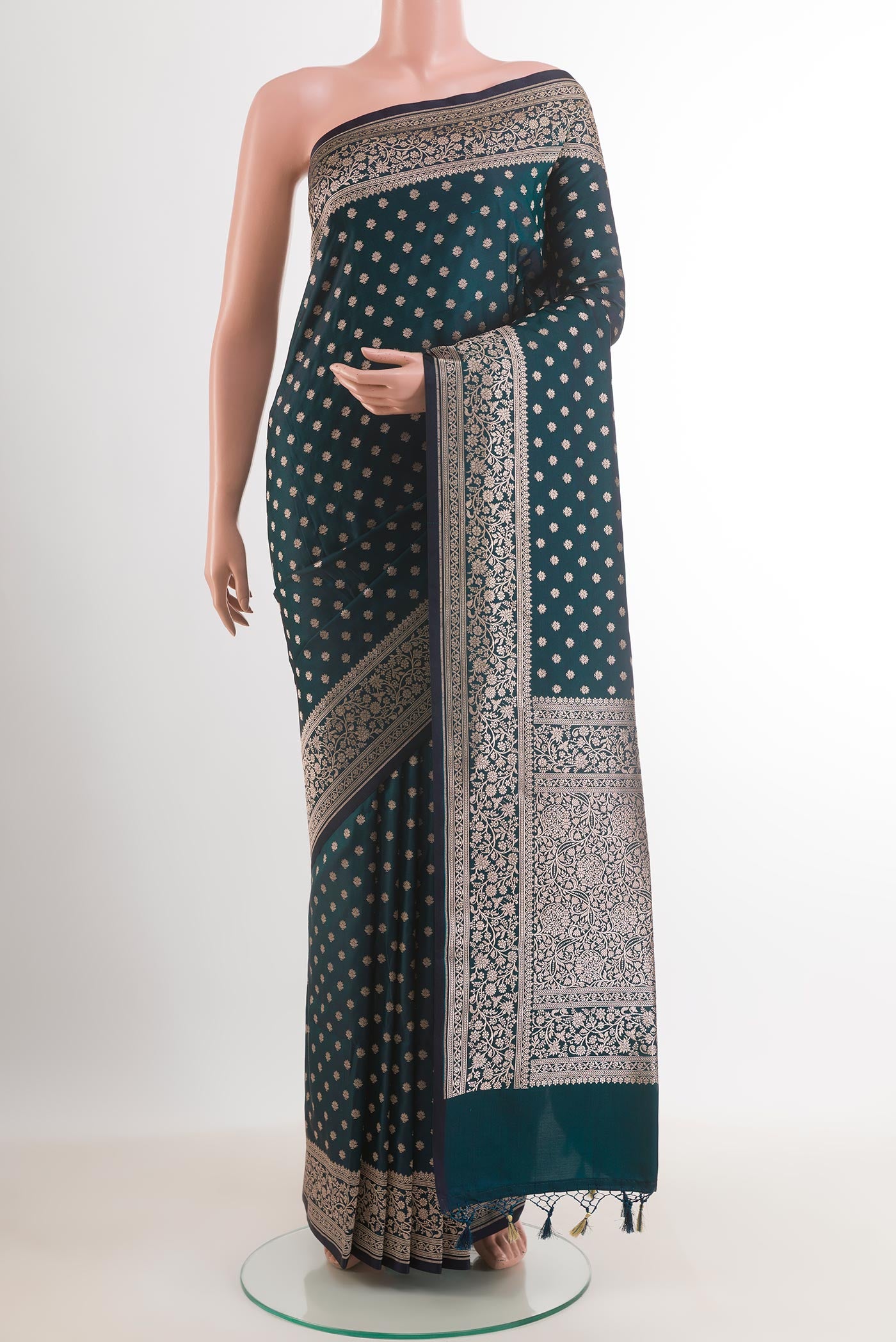 Green Blended Art Silk Saree with Zari Butta on the body and Zari Border.  displayed on a mannequin
