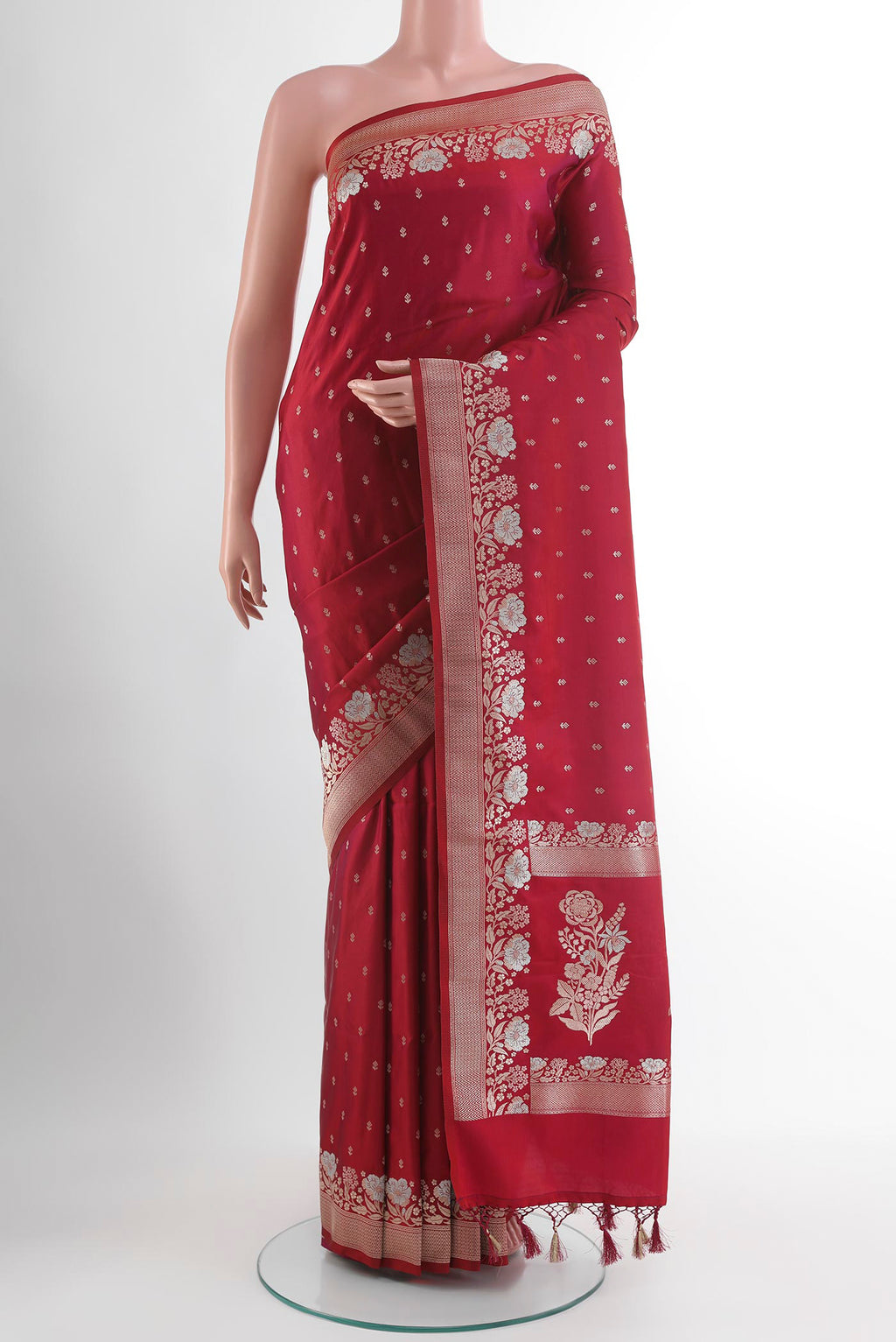 Maroon Blended Art Silk Saree with Zari Butta on the body and Zari Border.  displayed on a mannequin