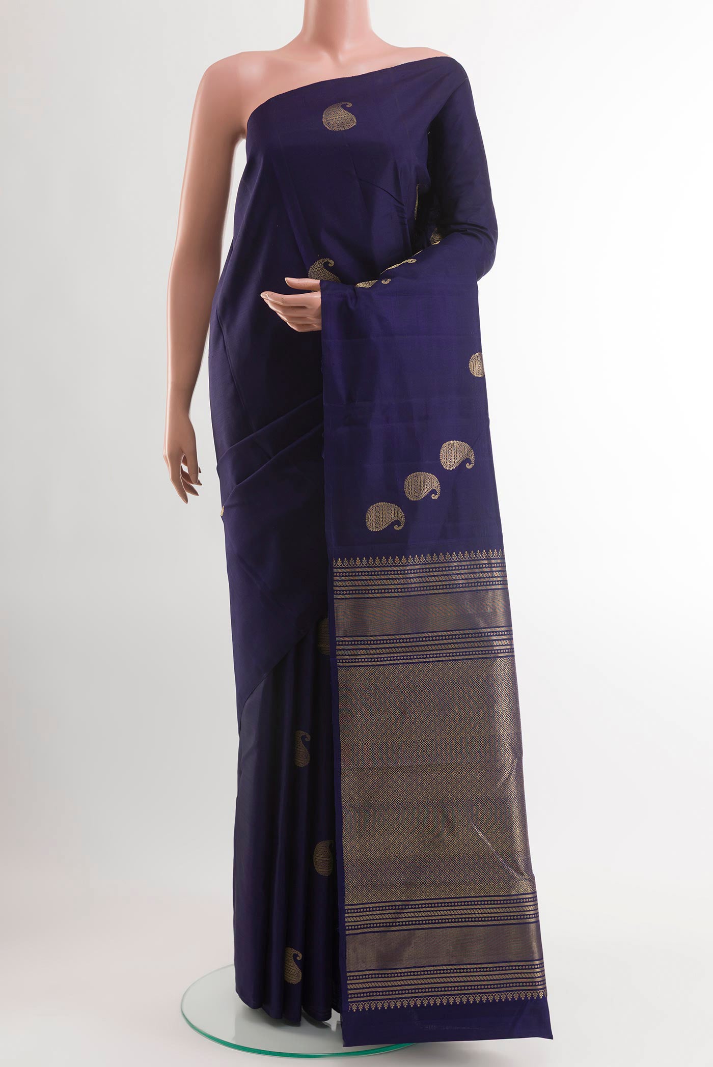 Blue Kanchipuram Silk Saree with Zari Butta on the body and Zari Border.  displayed on a mannequin