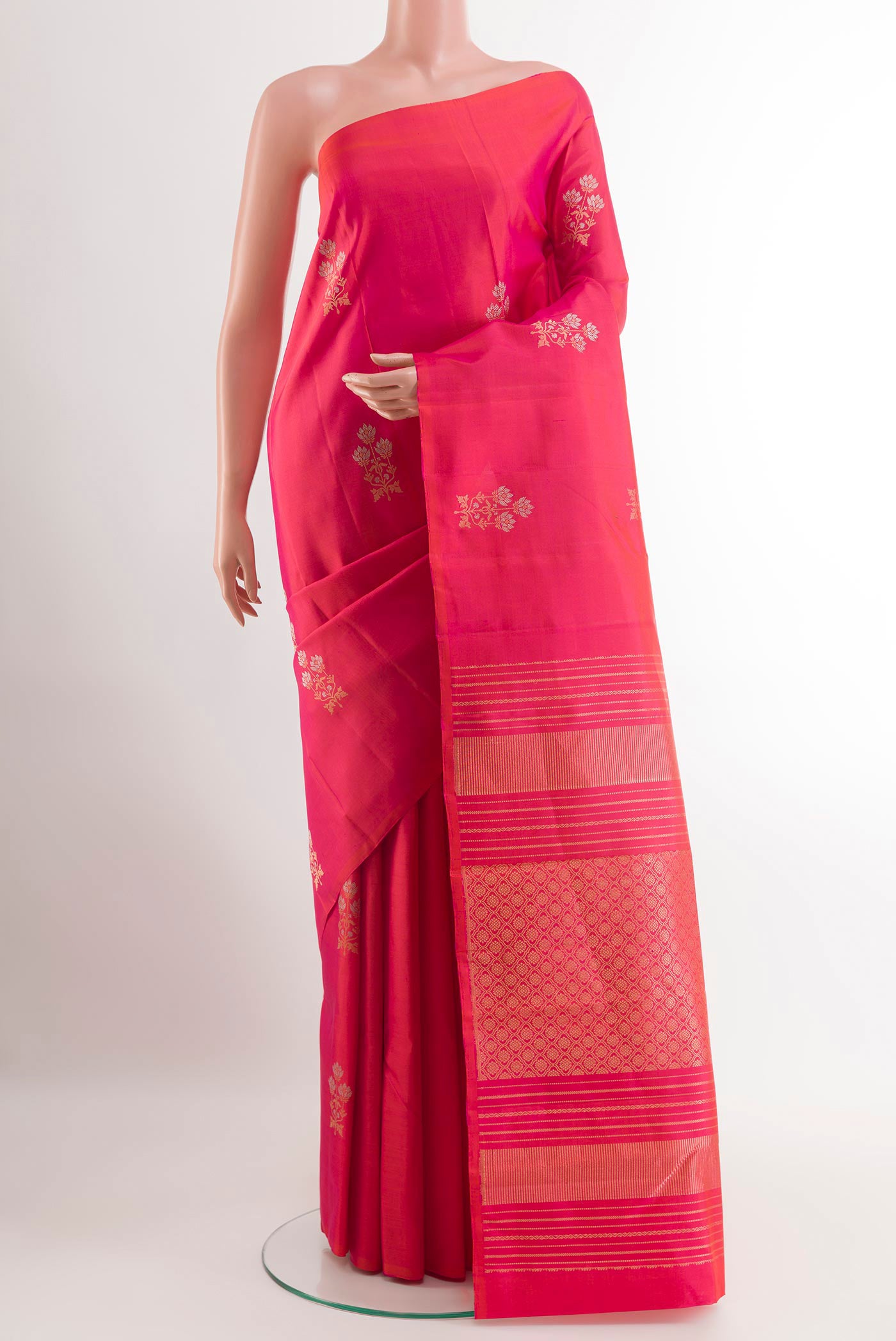 Pink Kanchipuram Silk Saree with Zari Butta on the body and Zari Border.  displayed on a mannequin