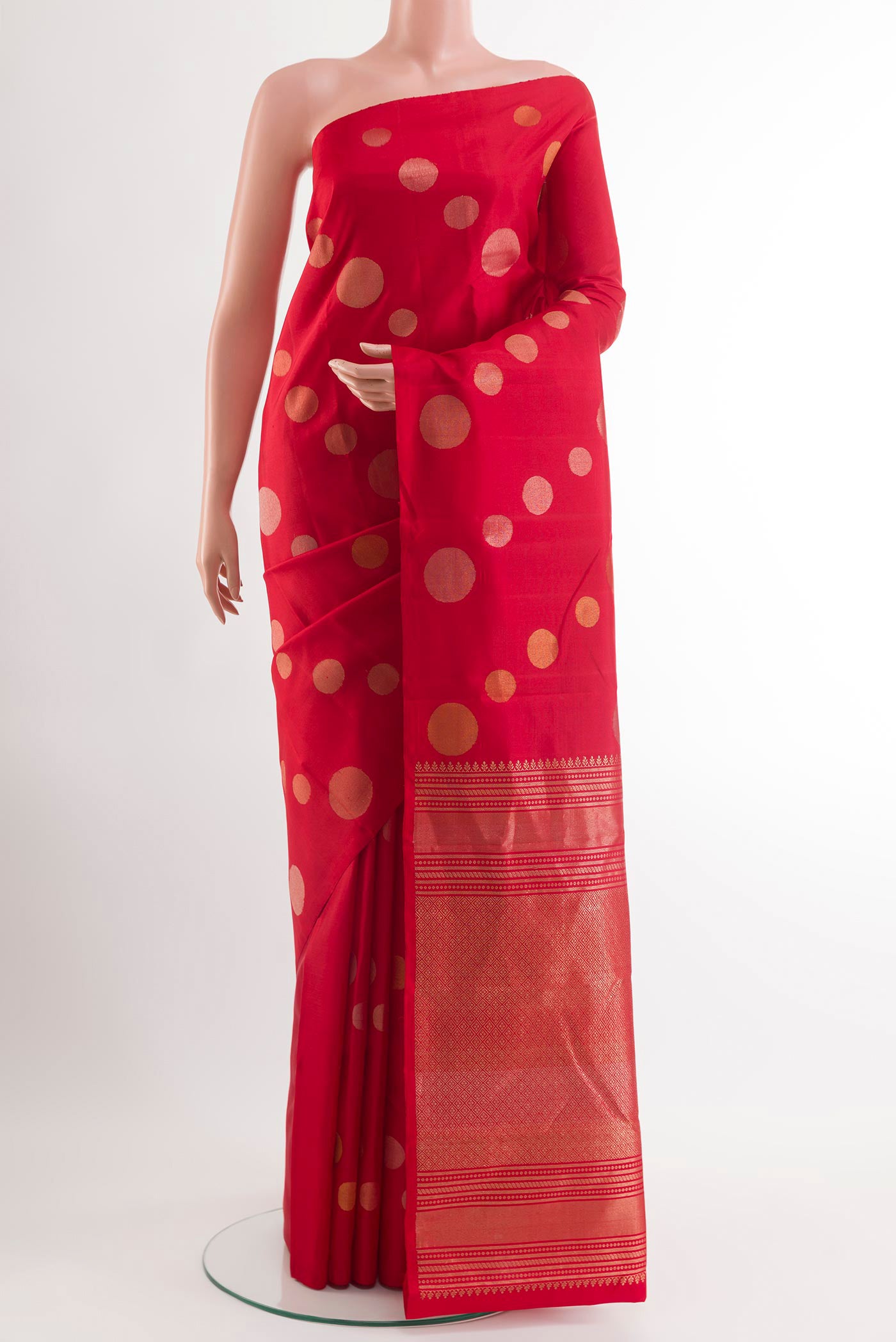 Red Kanjivaram Silk Saree with Zari Butta on the body and Zari Border.  displayed on a mannequin