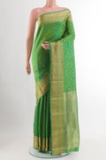 Green Dual Tone Kanjivaram Silk Saree with Zari Butta on the body and Zari Border.  displayed on a mannequin