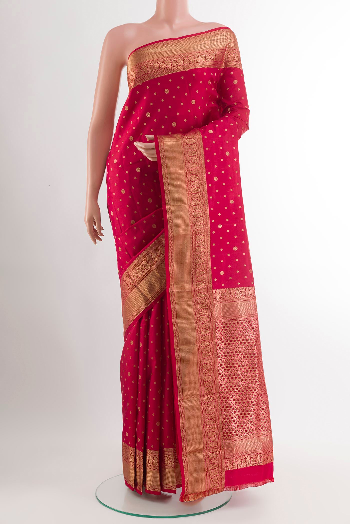 Red Kanjivaram Silk Saree with Zari Butta on the body and Zari Border.  displayed on a mannequin