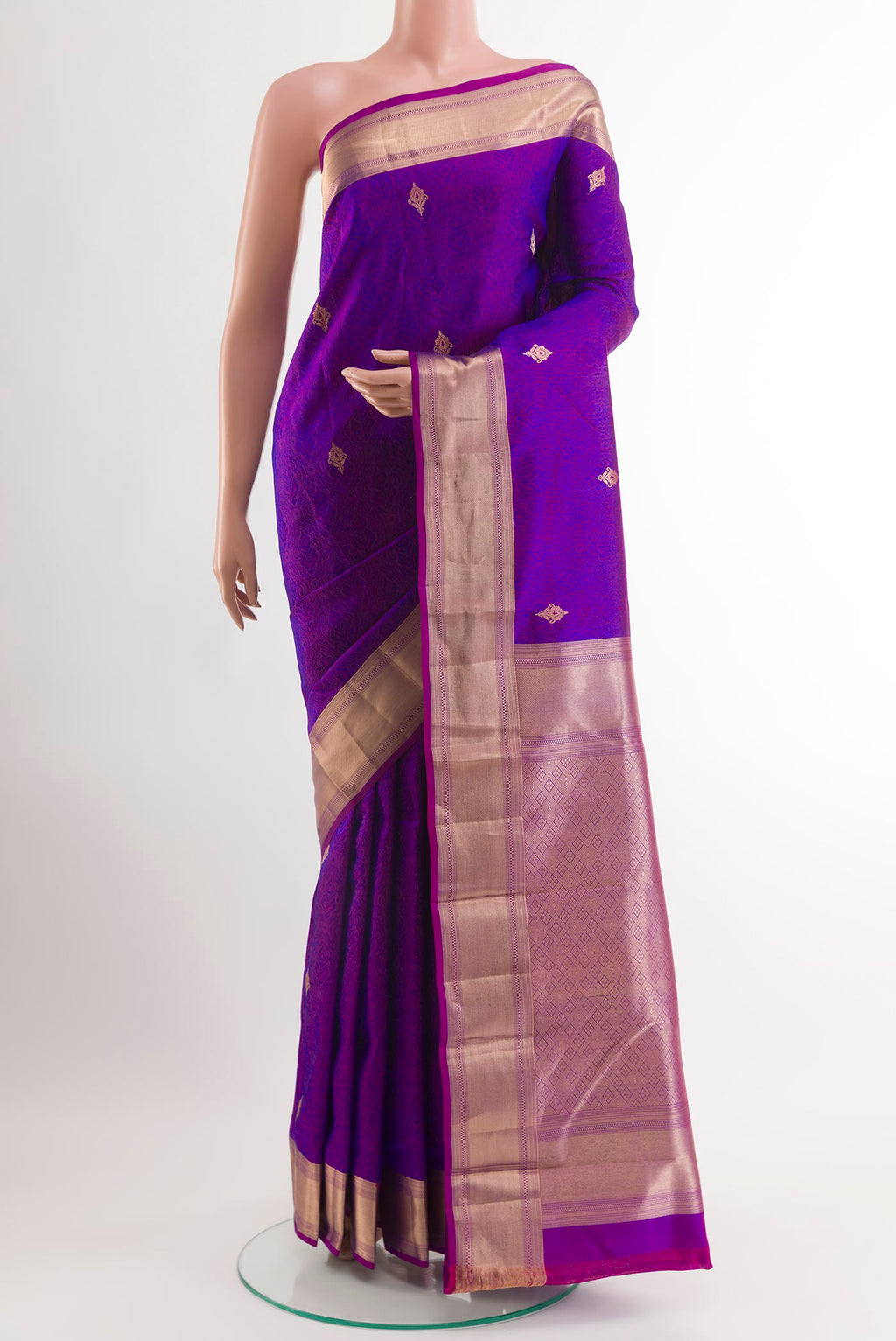 Purple Kanjivaram Silk Saree with Jacquard With Zari Butta on the body and Temple Border.  displayed on a mannequin