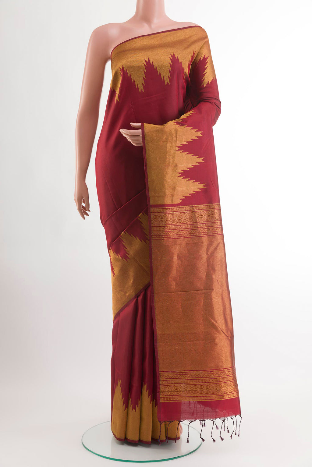Maroon Kanchipuram Silk Saree with Plain Body and Temple Border.  displayed on a mannequin