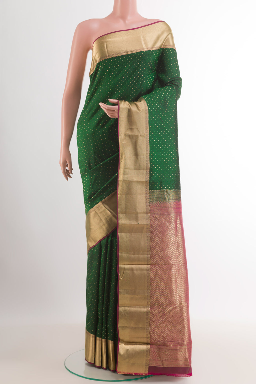 Bottle Green Kanjivaram Silk Saree with Zari Butta on the body and Zari Border.  displayed on a mannequin