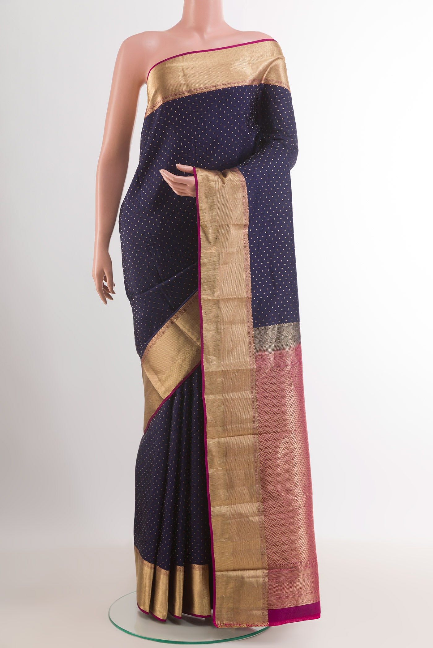 Dark Blue Kanjivaram Silk Saree with Zari Butta on the body and Zari Border.  displayed on a mannequin