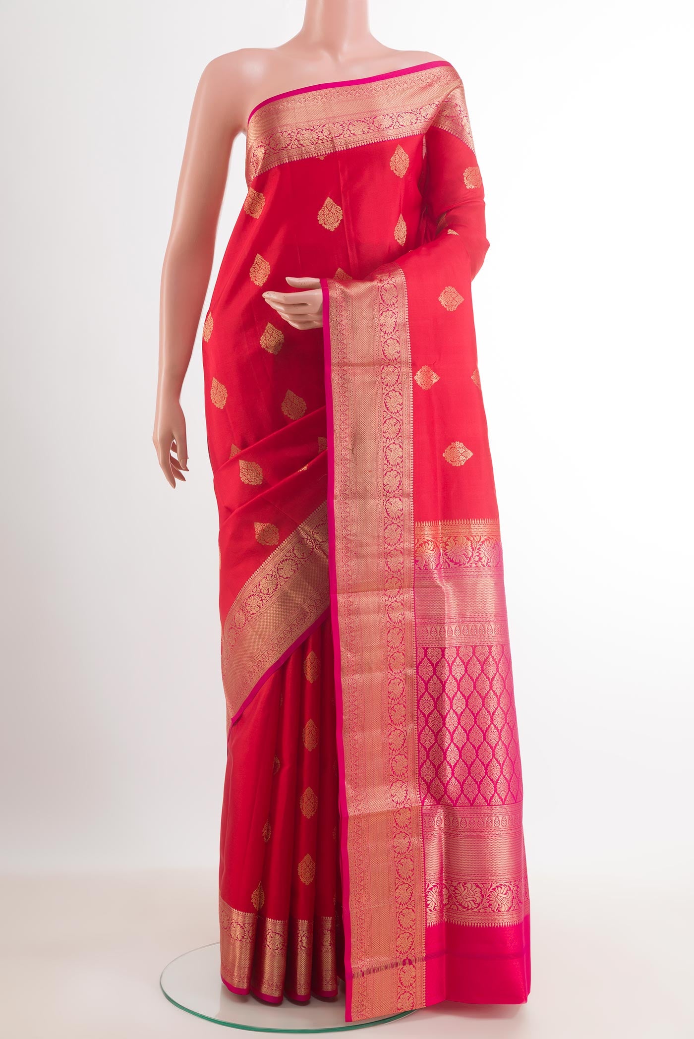 Red Dual Tone Soft Silk Saree with Zari Butta on the body and Zari Border.  displayed on a mannequin