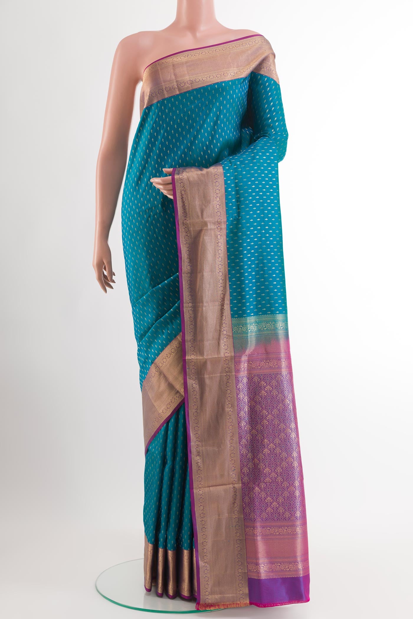 Blue Soft Silk Saree with Zari Butta on the body and Zari Border.  displayed on a mannequin